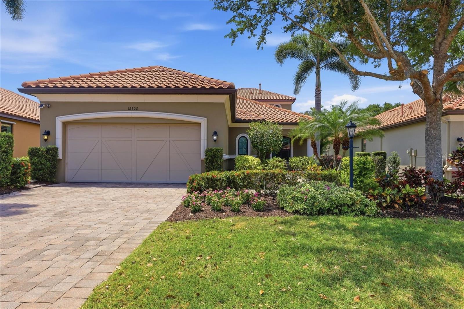 WAIT TILL YOU SEE this newly renovated, custom-built “Trevi” floor plan with 4 baths, one Master bedroom, TWO en-suites, dining room, office, ample sized loft, super rare FOUR FOOT garage extension AND stunning pebble tech coated heated pool with a resort-style cabana! This property is also located on a desirable "loop road". The grand entryway sets the stage for this high-end experience, focusing on the oversized, open spaces enhanced by captivating pool deck Vistas overlooking the undisturbed rear preserve (NO neighbors). Rest assured your new home is built super strong with its concrete block construction, HURRICANE IMPACT WINDOWS AND motorized HURRICANE IMPACT shade for the covered lanai. Additional features include: Paver driveway, rain gutters, 10'+ high ceilings throughout with multiple tray ceilings, premium luxury vinyl plank flooring, high-end light fixtures, crown molding, custom closet cabinetry, and MUCH more. Open the three-paneled slider and step outside to your freshly painted paver rich lanai and you will be instantly captivated by this backyard oasis! Your new home features a resort style cabana with LED recessed lighting, a large flatscreen for gamedays, a dog run for your furry friends AND a custom built heated pool with super smooth "Pebble Tech" surface! Your new modern kitchen boasts a LARGE island with a breakfast bar, a full suite of premium Stainless Steel appliances, 5-burner gas range, a closet pantry with custom cabinetry and LED undercabinet lighting that compliments the high level quartz countertops and matching backsplash! The master suite located downstairs boasts immense space, HEATED flooring, custom trey ceiling and large windows that allow Florida sunshine inside. The oversized primary bathroom provides his-and-hers vanities, an amply sized walk-in shower and a walk-in closet larger than most bedrooms, complete with wall-to-wall custom cabinetry ideal for clothing storage. The second bedroom also located downstairs provides guests with their own full bathroom, featuring a walk-in shower and large walk-in closet. As you make your way upstairs you will be amazed at the space the loft provides, perfect for a movie room, home gym, play room etc. The SECOND suite is also upstairs, offering even more space for guests with a built-in closet and full bathroom. Both the loft and the upstairs en-suite share amazing views of the private rear preserve! The oversized 3 car garage is equipped with an insulated HURRICANE IMPACT rated garage door, an abundance of space thanks to the heavy duty storage shelves throughout the walls as well as ceiling AND ample parking with its rare FOUR FOOT garage extension! If you are looking for an inspired living lifestyle, Esplanade Golf Country Club provides carefree living with an array of resort style amenities: 18-hole World Class Championship golf, aqua range, with PGA golf professionals lessons, Pro shops, fully gated & secured, maintenance free living. Esplanade Amenity Center offers lagoon-style lap and resistance pools, spa services, state of the art fitness center, a pet park, a canoe and kayak launch, sport courts, pickleball courts and nature trails. Socialize with friends around the fire pit anytime. Sports enthusiasts will enjoy tennis programs and lighted Har Tru courts. Experience fine and casual dining, cooking classes in the culinary center, dance lessons, and more! Ride your golf cart to the Bahama Tiki Bar to listen to music and enjoy a cocktail.