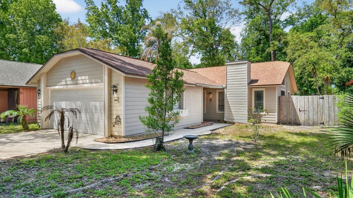 Tucked in a quiet cul-de-sac in desirable Tymber Creek, this move-in ready 2BR/2BA home offers comfort, privacy, and low maintenance living. Bright open layout with abundant natural light, open kitchen to dining area, and cozy living room with wood-burning fireplace. No carpet throughout, with wood and tile flooring for a clean, low-maintenance feel. Generous closet space and spacious 2-car garage. Large primary bedroom features private bath, his & hers closets and sliding door to screened porch, providing a nice retreat. Enjoy screened porch and adjoining decks overlooking peaceful surroundings. Cul-de-sac includes a charming small park at its center. Updates include new roof (2022), new water heater (2026), NEW AC handler (2025), cleaned AC ducts (2026), upgraded fireplace interior and cover, 3 replaced windows, & gutters with screen covers. Tymber Creek offers gated security, 2 pools, tennis & pickleball courts, playground, clubhouse and scenic lake for kayaking or canoeing.