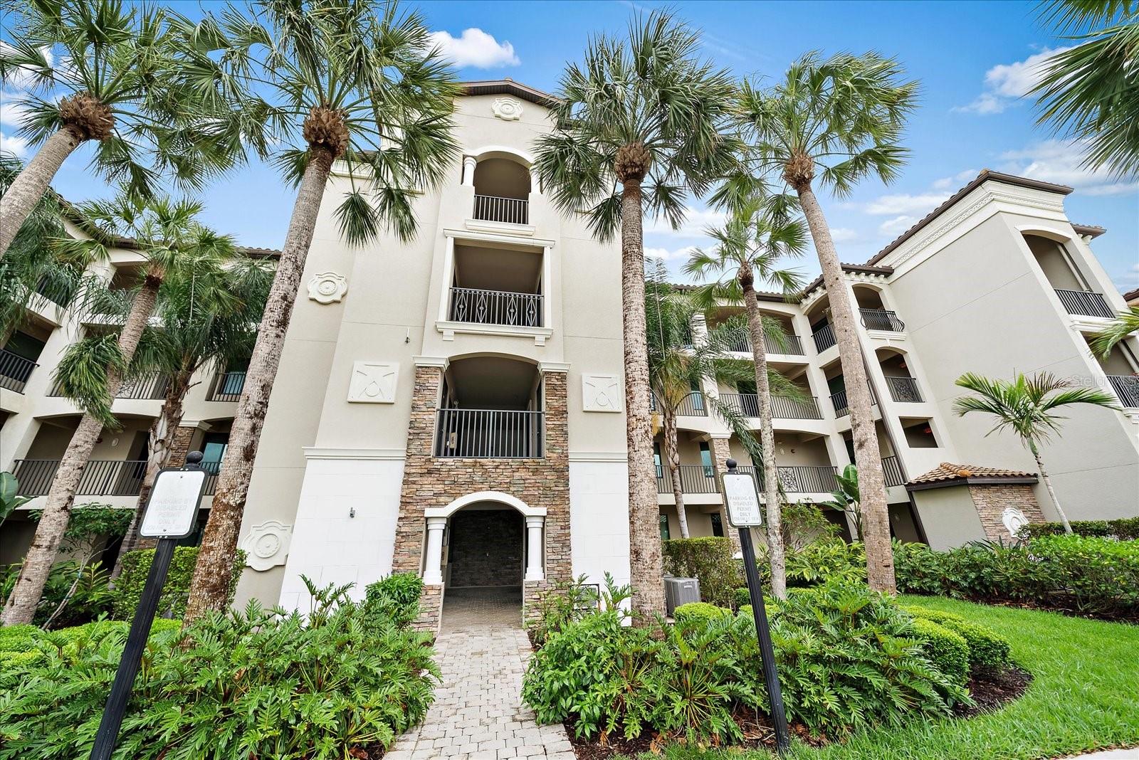 Welcome to lakeside living nestled within the highly sought-after gated community of Lakewood National Golf Club in Lakewood Ranch — where resort-style comfort meets everyday ease.

This striking first-floor condominium offers a thoughtfully designed open floor plan spanning over eleven hundred square feet of welcoming space. Gorgeous golf course view of the 11th & 12th holes of the Commander course. Step inside to soaring ceilings in the entryway complemented by crown molding throughout, while recessed lighting casts a warm, inviting glow across every room. The kitchen is a culinary dream, featuring light cream-colored cabinets,  stone countertops, gleaming stainless steel appliances, and a breakfast bar. The bay window gives expansion and awesome views from the kitchen, dining, breakfast, and living rooms, captures stunning lake views that make morning coffee feel like a vacation. The screened lanai, with privacy shades, extends your living space with calming water vistas, perfect for unwinding after a round on one of two Arnold Palmer-designed championship courses included with ownership. This first-floor unit is wonderful and convenient for pet owners. 

The primary bedroom suite features plush carpeting, a built-in closet, and an ensuite bathroom with a walk-in shower, offering a peaceful relaxing private sanctuary after a busy day working or out enjoying the community, local businesses shopping and dining, or a day spent at one of the areas beautiful beaches! 

Beyond your door, a true resort lifestyle awaits — a grand clubhouse with full-service dining, a waterfall pool paired with a tiki bar, a top-tier fitness center and spa, Har-Tru tennis and pickleball courts, satellite pools, and a vibrant social calendar. Located in close proximity to University Town Center and beaches ensure everything you need is moments away.

Whether seeking a seasonal retreat, permanent residence, or smart investment, this is low-maintenance living crafted for those who value quality without compromise. Schedule your private showing today.