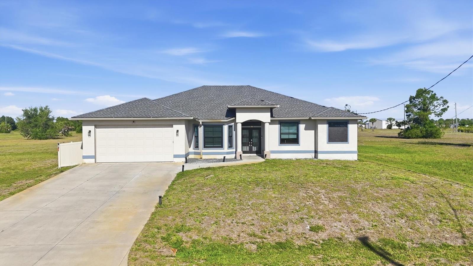 Welcome to this beautifully updated 4-bed, 2.5-bath pool home PLUS office in Rotonda Sands, built in 2012 by a respected Englewood builder and completely remodeled in 2024 to reflect today’s most desired finishes. Offering over 2,200 square feet of living space, this home sits on a generous 0.42-acre lot with a vinyl fenced yard and the rare opportunity to purchase an additional third lot, bringing the total to approximately 0.6 acres. Inside, you will find luxury vinyl plank flooring throughout and a spacious, open layout designed for both everyday living and entertaining. The kitchen is a true centerpiece, featuring a large quartzite island with two built-in wireless charging stations, ample cabinetry, and seamless flow into the dining area, which includes a dry bar and additional storage. The home also offers a dedicated office with a convenient half bath, ideal for remote work or flexible use. The primary suite is designed for comfort, with dual closets and a well-appointed ensuite bath featuring a walk-in shower, dual sinks, and a separate vanity area. Storage is abundant throughout the home, including cabinets in the laundry room and a linen closet. Step outside to enjoy your private pool and take in stunning Southwest Florida sunsets from your backyard oasis. When you are ready to explore, you are just approximately 3 miles from Boca Grande and only minutes from the beaches of Englewood and Venice. Boating enthusiasts will appreciate the nearby marinas and easy Gulf access, while dining, shopping, and local farmers markets offer something for everyone. This 4-bed pool home in Rotonda Sands delivers the ideal blend of space, upgrades, and location. Schedule your showing today and secure your piece of Southwest Florida paradise.