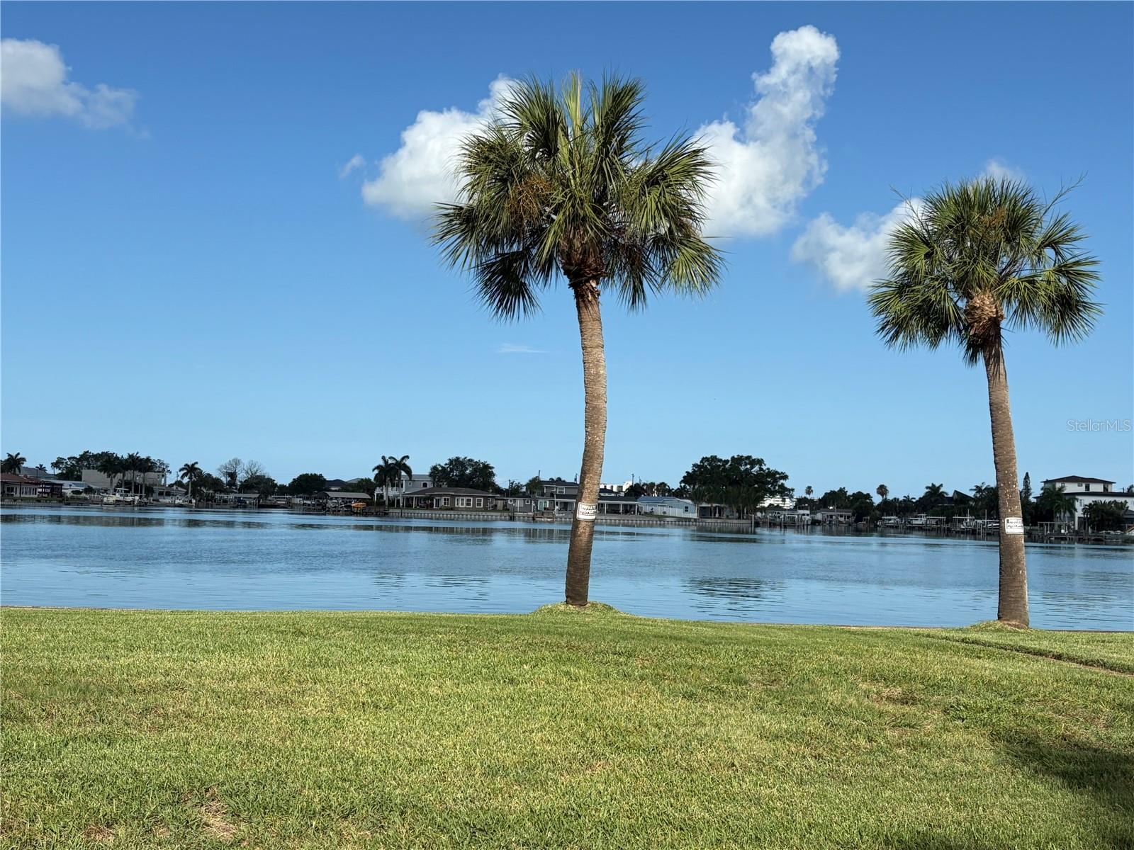 Charming Waterfront View Home with Pool and Timeless Character! Situated just across from the water along scenic Sunset Drive S, this beautifully maintained home offers picturesque water views and a wonderful blend of classic charm and modern updates. Gleaming original oak floors have been professionally refinished and extend through the living room, dining room, kitchen, and two bedrooms, preserving the home's appeal. Designed for both everyday living and entertaining, the spacious floor plan features four bedrooms, two and a half baths, and an inviting formal dining room ideal for hosting family and friends. French doors from the family room open to a private backyard oasis complete with a sparkling pool perfect for relaxing on warm Florida days. Recent improvements include impact-resistant double pane windows installed in 2023, a new roof in 2022, and thoughtfully updated kitchen and baths. Alley access leads to the garage, adding convenience and functionality. Lovingly maintained with exceptional attention to detail, this special home has retained the warmth and character of a true family residence while benefiting from numerous modern updates. Don't miss the opportunity to experience its charm, water views, and inviting lifestyle - schedule your showing today!