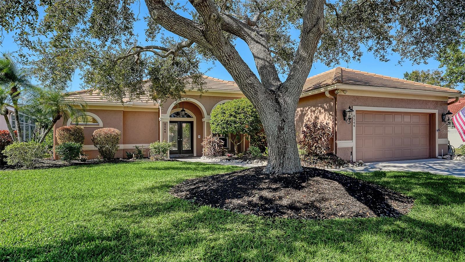 TURTLE ROCK..  Classic style and beautifully maintained pool home in the gated Palmer Ranch community. Bright, open floor plan and inviting indoor-outdoor living. Traditional layout provides excellent flexibility with separate living, dining and family rooms, room for a baby grand piano! Enhanced by ceramic tile flooring laid on the diagonal, architectural niches, crown molding, recessed lighting and generous storage throughout.  Large covered entry leading to the spacious foyer with decorative inlay and coat closet create a welcoming first impression. The kitchen features beveled-edge granite countertops, stainless steel appliances, under-cabinet lighting, large pantry closet, and an eat-in breakfast nook with an aquarium window and built-in desk nook. Opening to the family room with vaulted ceiling, built-ins and a full wall of pocketing sliding glass doors leading to the pool. A convenient powder bath also serves as the pool bath. The primary suite offers lanai access, tray ceiling, two walk-in closets, and an ensuite bathroom with dual vanities, makeup vanity, updated countertops and lighting, Jacuzzi tub, large tiled walk-in shower with built-in bench, and a private water closet. Two additional bedrooms share a full bath with granite countertop; one bedroom includes stylish built-ins and a desk, making it ideal as a home office, den, or guest room with a sleep sofa and closet. Well-appointed laundry room with LG washer and dryer, sink, built-in cabinetry and closet. Two-car garage with epoxy flooring, built-in storage and an impressive 13-foot-long air-conditioned and heated storage room. Outdoor living  with an inground pool featuring a waterfall, bronze screen enclosure, outdoor shower, and a covered lanai with ceiling fan and sun shades. A/C system replaced (Nov 2023), roof replaced (2016), instant tankless hot water heater, reverse osmosis water filtration system and lawn irrigation with reclaimed water. Mature, lush landscaping surrounds the property. Turtle Rock is a gated community known for its scenic lakes, mature landscaping, and resort-style amenities, including a heated community pool, clubhouse, tennis and pickleball courts, basketball court, playground, and miles of walking and biking trails. Ideally located just minutes from the Legacy Trail for walking and biking, shopping, dining, top-rated schools, and a short drive to world-famous Siesta Key Beach.