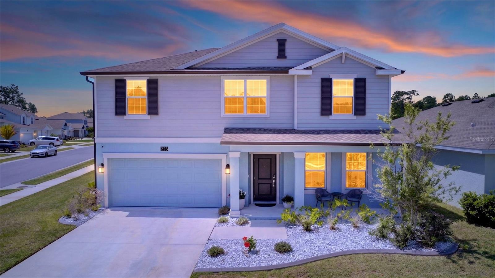 Welcome to the kind of home buyers ask for every single day... newer construction, room to grow, energy efficiency, and a location that makes everyday life easier.

Built in 2023 and beautifully maintained, this move in ready two story residence offers 5 true bedrooms plus a dedicated office/flex room that could easily function as a 6th bedroom, playroom, media room, or guest retreat. Inside, soaring ceilings and an open concept layout create a bright, connected feel, while modern finishes including tile throughout the living areas, recessed lighting, stainless steel appliances, and a spacious walk in pantry bring both style and function. Thoughtfully designed for everyday living, the home offers extensive storage throughout to support both function and flexibility. The thoughtfully designed first floor primary suite offers privacy and convenience with an extensive ensuite bath, while indoor laundry and flexible living spaces make everyday life effortless. Outside, enjoy the curb appeal of professional landscaping and hardscaping with decorative rock, a welcoming covered front porch, rear patio, front and rear irrigation, and desirable corner lot positioning.

And the feature that truly sets this home apart... the whole house solar system is fully paid off by the seller, allowing you to enjoy the benefits of energy efficiency from day one without the added expense. Additional highlights include hurricane wind rated double pane windows, professionally painted interiors, and a home security surveillance system that conveys.

Residents enjoy access to the community pool and an unbeatable location with quick access to I-95 and I-4, shopping, schools, hospitals, universities, airports, cruise terminals, and Daytona Beach less than 15 minutes away. Enjoy being just minutes from Daytona International Airport and close to the energy and excitement of NASCAR events, entertainment, and year round attractions while still coming home to a quiet residential setting.

This isn't just newer construction... it's the opportunity to skip the projects, avoid the upgrade costs, and start enjoying life from day one.

All information is intended to be accurate; however, Buyer and Buyer's agent should independently verify any information important to Buyer's purchasing decision.