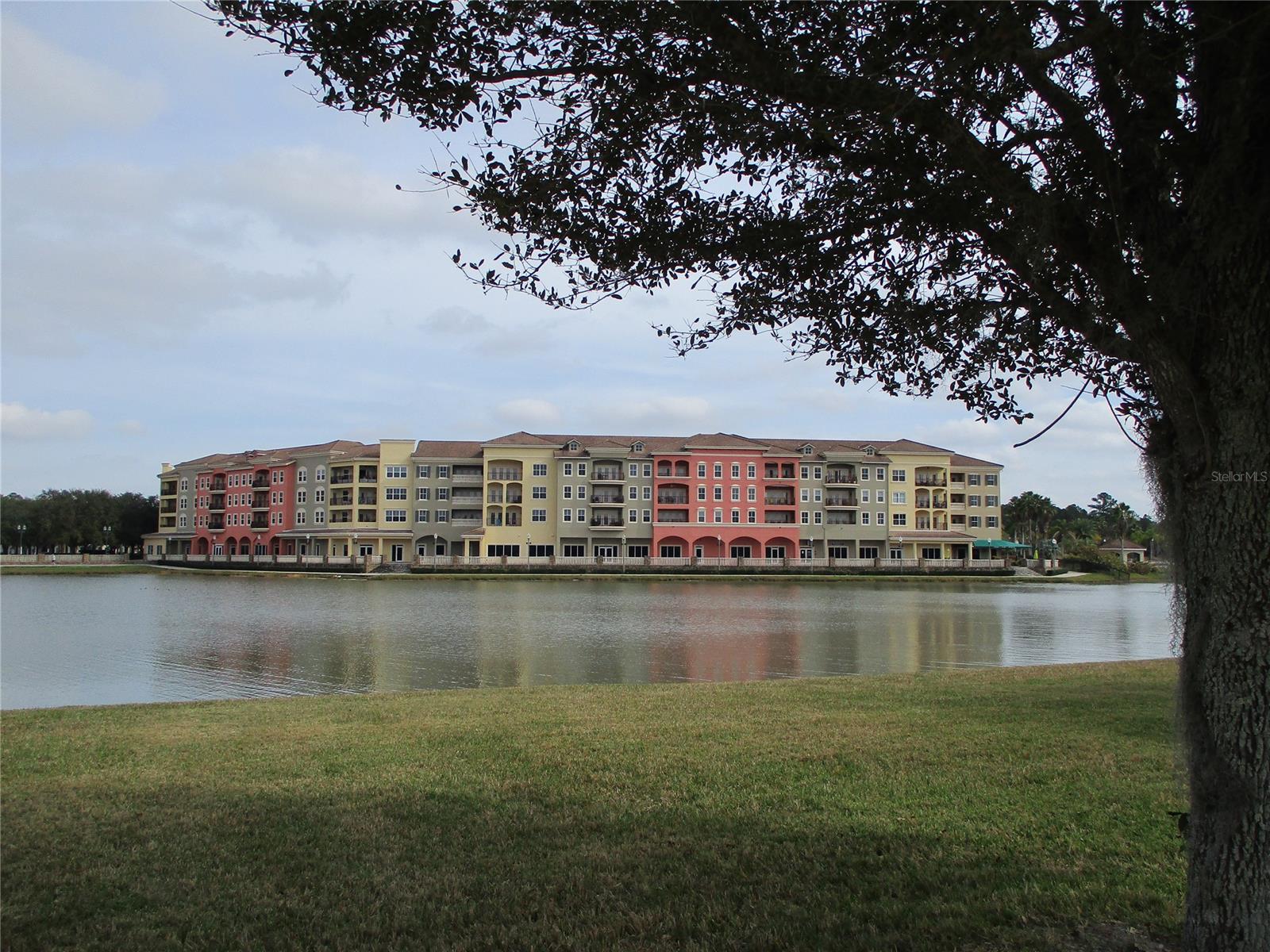 This unit offers the best Venetian Square condos has to offer.  The private 1 and 1/2 car garage is located just steps from the elevator. Enter to the lovely foyer space, down the hall to the open concept dining and living area flooded with light from the french doors that open to the huge patio space perfectly positioned to the west to take in the sunset over the lake.  The kitchen space offers two pantries and room for an eat in breakfast nook. The living space includes a wet bar for entertaining and tons of natural light. Master bedroom includes a huge ensuite with separate shower and soaking tub, his and hers closets, views of the the lake, and access to the private patio. Brand new luxury vinyl floors  throughout, updated lighting features,  charming french style doors to bedrooms, spacious in unit laundry, and just around the corner additional private unit storage.  Right outside your front door is the Venetian Bay resort pool, and all the town center has to offer!  This view you have to see to believe, schedule a showing today. ;Water: City