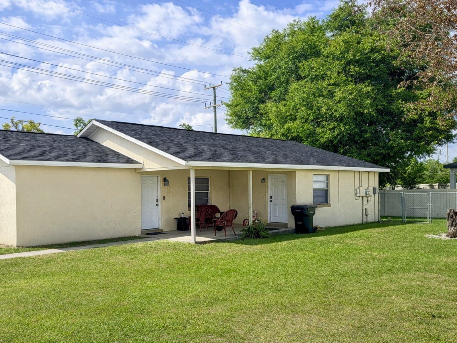 One or more photo(s) has been virtually staged. 2359 / 2361 Chestnut Hills Drive | Lakeland, FL 33805
NEW ROOF Turnkey Duplex – Ideal for Owner-Occupant or Investor

Excellent opportunity to own a well-maintained concrete block duplex offering two separate units, each designed for comfortable living and easy rental appeal. Whether you’re looking to house-hack, expand your rental portfolio, or secure a low-maintenance investment, this property checks the boxes.

Each unit features a functional open layout with durable tile flooring throughout, making upkeep simple and tenant turnover easy. Bright living spaces flow into practical kitchens equipped with ample cabinetry, laminate countertops, tile backsplash, and full appliance packages. In-unit washer and dryer add everyday convenience—an attractive feature for both owners and tenants.

Both units include spacious bedrooms, updated bathrooms with tiled tub/shower surrounds, and neutral finishes ready to suit any style. Ceiling fans and abundant natural light enhance comfort throughout.

Outside, enjoy a large fenced yard, private entrances, and off-street parking. The concrete block construction and straightforward layout provide long-term durability and reduced maintenance costs.

Conveniently located with quick access to major roads, shopping, dining, and employment centers, this property offers strong rental demand and long-term upside in the Lakeland market.