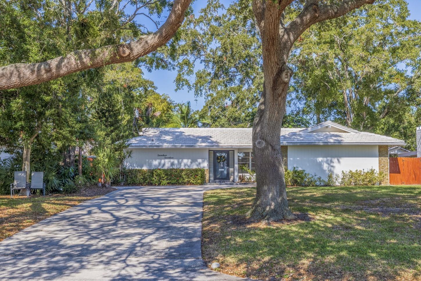 BEAUTIFUL GOLF COURSE HOME IN LAKEWOOD ESTATES – AMAZING LOCATION - Nestled between our vibrant downtown and just minutes from our award-winning beaches, this Lakewood Estates home offers many wonderful benefits and features. One of the most notable being the large lot and quiet location overlooking the 15th fairway of the St Petersburg Country Club golf course! The very moment you enter this home, you are welcomed by exceptional natural light. Offering 2 large bedrooms, 2 bathrooms, and an oversized 1-car garage. Your new home has exceptional entertainment space and exceptionally large rooms. The spacious kitchen offers plenty of cabinet space and a breakfast nook that is great for morning coffee! There are many wonderful mid-century features throughout. The wide-open main living area is super-spacious! Your private backyard provides an exceptional outdoor area for relaxing, grilling, or simply enjoying time with friends and family. You will discover pathways, lush landscaping, and your very own courtyard that is great for cool evening get-togethers. This part of St Petersburg continues to grow in popularity due to the large lots, convenient location, and close proximity to so many points of interest. High and dry Zone X. Lakewood Estates is conveniently situated adjacent to the Boyd Hill Nature Park, St. Petersburg Golf & Country Club, and offers easy access to our spectacular Gulf Beaches, cosmopolitan Downtown, and all the new and exciting developments of The Skyway Marina District. If you have been searching for AMAZING – here it is. If you have been waiting for the IDEAL OPPORTUNITY – it is now. If you have expectations of an EXCEPTIONAL LOCATION – Your search ends right here at 1717 Anastasia Way S!  Learn more at https://tinyurl.com/1717Anastasia