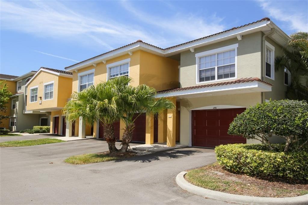 Resort-Style Living in a Gated Community! AVAILABLE IMMEDIATELY, this spacious 3-bedroom, 2-bath townhouse-style condominium offers the perfect blend of comfort, convenience, and resort-style amenities. Featuring an attached 1-car garage and a desirable open floor plan, this home has been thoughtfully updated with modern kitchen cabinetry, granite countertops, stainless steel appliances, and attractive laminate flooring throughout the main living areas. The bright and airy living space opens to a screened balcony overlooking a peaceful pond, creating the perfect spot to enjoy your morning coffee or unwind at the end of the day. The generous primary suite features an ensuite bath with dual vanities, while two additional bedrooms provide flexibility for guests, a home office or whatever use your heart desires! One of the most sought-after features is the private in-unit laundry room—no trips to a community laundry facility here! Residents enjoy access to exceptional community amenities, including: Two resort-style swimming pools, Two fitness centers, Tennis courts, Playground, Gated entry, Beautifully maintained grounds and walking areas. Conveniently located near shopping, dining, entertainment, and major roadways, this community truly feels like a year-round vacation destination. Available for immediate occupancy. Long-term lease only. First month's rent, security deposit, and credit/background screening required. Per community rules, no pets are permitted for tenants—no exceptions.  Allow up to 3 weeks for required condo association tenant approval process.