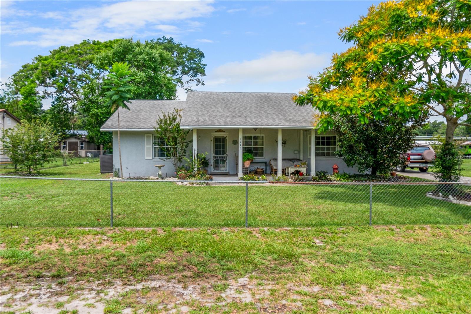 Spacious 4-Bedroom Home with Private Guest Suite on Nearly Half an Acre – No HOA! Tucked away on a quiet cul-de-sac, this beautifully cared-for 4-bedroom, 3-bathroom home serves up space, privacy, and flexibility on nearly half an acre of fully fenced land — and the best part? No HOA telling you what to do. One of the coolest features is the attached, fully handicapped-accessible guest suite with its own private entrance—ideal for multigenerational living or giving guests their own space (and keeping yours). This suite is impressively self-sufficient, complete with its own water heater, electric panel, septic tank, and water shut-off valve. It’s basically a home within a home. Inside, the main house delivers a functional layout with generously sized bedrooms and a living area that’s just waiting for game nights, or the occasional dance party. Outside, you’ve got plenty of room to roam, play, garden, or just enjoy some peace and a quiet get away.