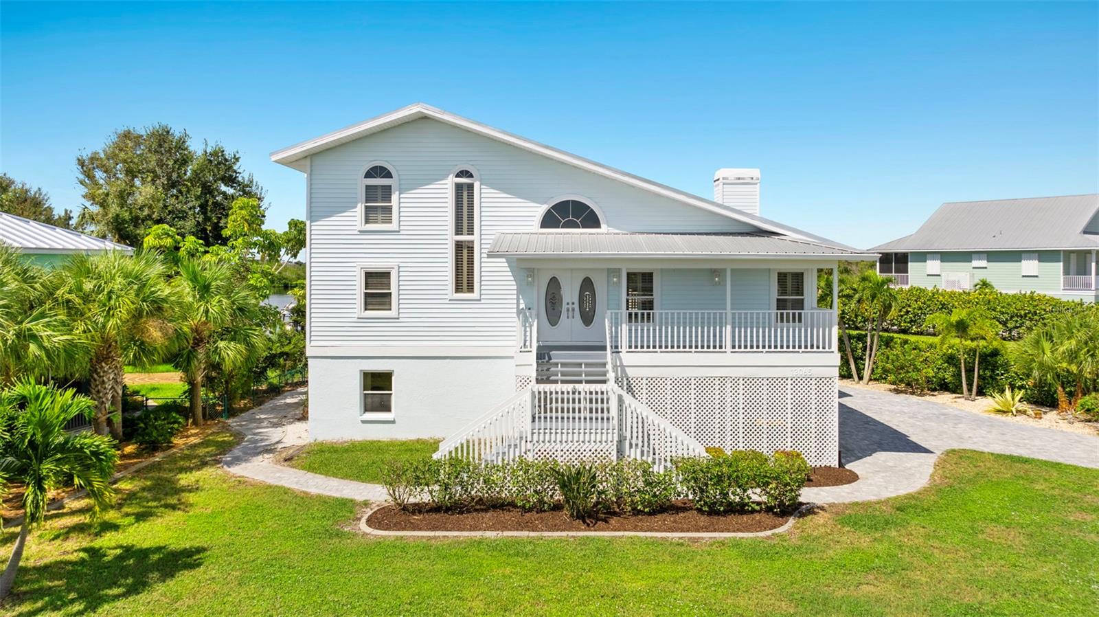 Breathtaking views can be yours from this beautiful 3 story custom WATERFRONT home, located on boat accessible water to Coral Creek, minutes to LGI, Bull Bay, or Boca Grande Pass.  In-law suite with private entrance and kitchenette. New kitchen with farmhouse sink and top of the line cabinetry and gorgeous countertops along with hi-end designer range. Big bay window overlooking the water, a large living room features a soaring wood ceiling and fireplace. Master suite also overlooks the water with a balcony to enjoy the sunrise or sunset. Lower level includes a separate entrance and can be locked off from the upper levels, and features a 2nd kitchenette, bedroom and bathroom, and 2 large living areas or game rooms.  An elevator services the first and second floors. New flooring throughout, new interior and exterior paint. Placida Pointe is a community with amazing amenities including marina, tennis, pickleball, 3 pools, 2 clubhouses, fitness, private ferry to your own slice of paradise on Little Gasparilla island with miles of white sand beaches.