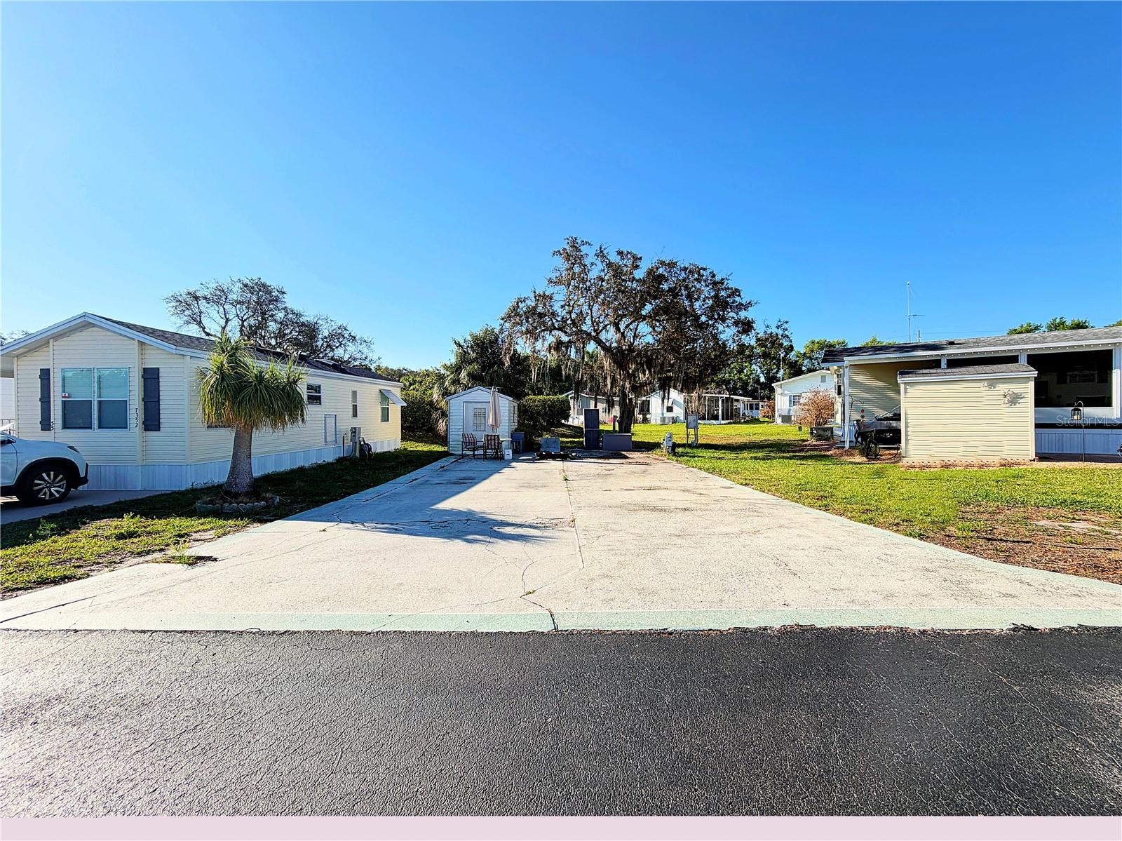 PRICE REDUCED on this AMAZING RV LOT!!!!  Welcome to your perfect 55+ getaway in beautiful Lake Wales! Located in a well-established and welcoming 55+ RV community, this spacious RV lot offers the ideal blend of comfort, convenience, and resort-style amenities. The property features a paved RV pad for easy setup and maintenance, along with a storage shed—perfect for keeping tools, outdoor gear, or seasonal items neatly organized. Whether you're a seasonal visitor or a full-time resident, this lot is ready for you to enjoy from day one. Residents enjoy access to a lakefront clubhouse, sparkling community pool, shuffleboard courts, community dock, and convenient on-site laundry facility—everything you need to relax and stay active. Even better, the low HOA fee includes sewer, water, garbage, and grounds maintenance, offering exceptional value and truly low-maintenance living. The community also offers on-site storage for trailers, etc. and access to launch your boat.  If you’re looking for an affordable slice of Florida living with outstanding amenities in a peaceful lakeside setting, this is the opportunity you’ve been waiting for!