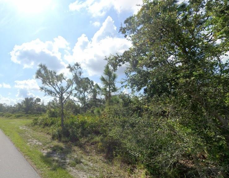 Discover the possibilities with this spacious 0.53-acre corner lot in Punta Gorda, offering an impressive 294.23 feet of road frontage and plenty of flexibility for your future homesite or investment opportunity. Enjoy the charm of Southwest Florida living with easy access to boating, fishing, golf, shopping, and waterfront dining. Spend your weekends exploring Fishermen's Village, strolling along the scenic Harborwalk, relaxing at Gilchrist Park, or enjoying the beaches, nature trails, and wildlife experiences that make Punta Gorda such a sought-after destination. With nearby access to Charlotte Harbor, historic downtown Punta Gorda, restaurants, marinas, and endless outdoor recreation, this oversized corner parcel offers the perfect blend of space, convenience, and the laid-back Florida lifestyle.