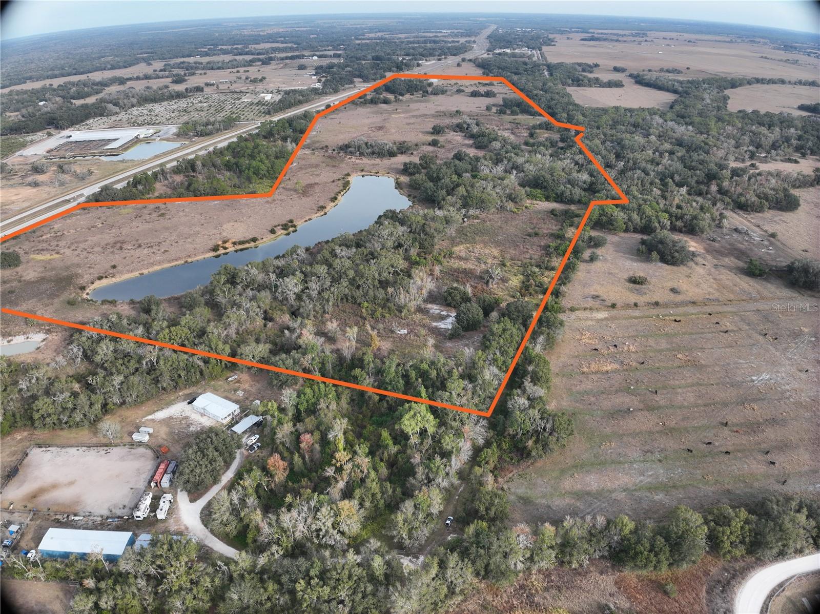 100 Acres • Highway Frontage • Lake • Creek • A-10 Zoning

Large tracts like this are becoming increasingly rare in Arcadia and DeSoto County, and this one checks all the boxes. This exceptional 100-acre ranch property offers a beautiful blend of improved pasture and natural woods, highlighted by a scenic 5-acre lake and a live creek winding through the southeast portion of the land.

With significant frontage on US Highway 17, access is easy while still offering outstanding privacy and wide-open Florida views. The property is fenced for livestock, making it ready for cattle, horses, or agricultural use from day one.

Multiple high and attractive locations provide ideal sites for a private estate, ranch headquarters, or family compound. The A-10 zoning also creates flexibility for potential division or future planning (buyer to verify).

This offering consists of an assemblage of four parcels, providing scale, usability, and long-term investment appeal.

Opportunities to secure acreage of this size, with water features and highway access, are limited. Whether you envision a working ranch, recreational retreat, or land-bank investment, this property delivers.