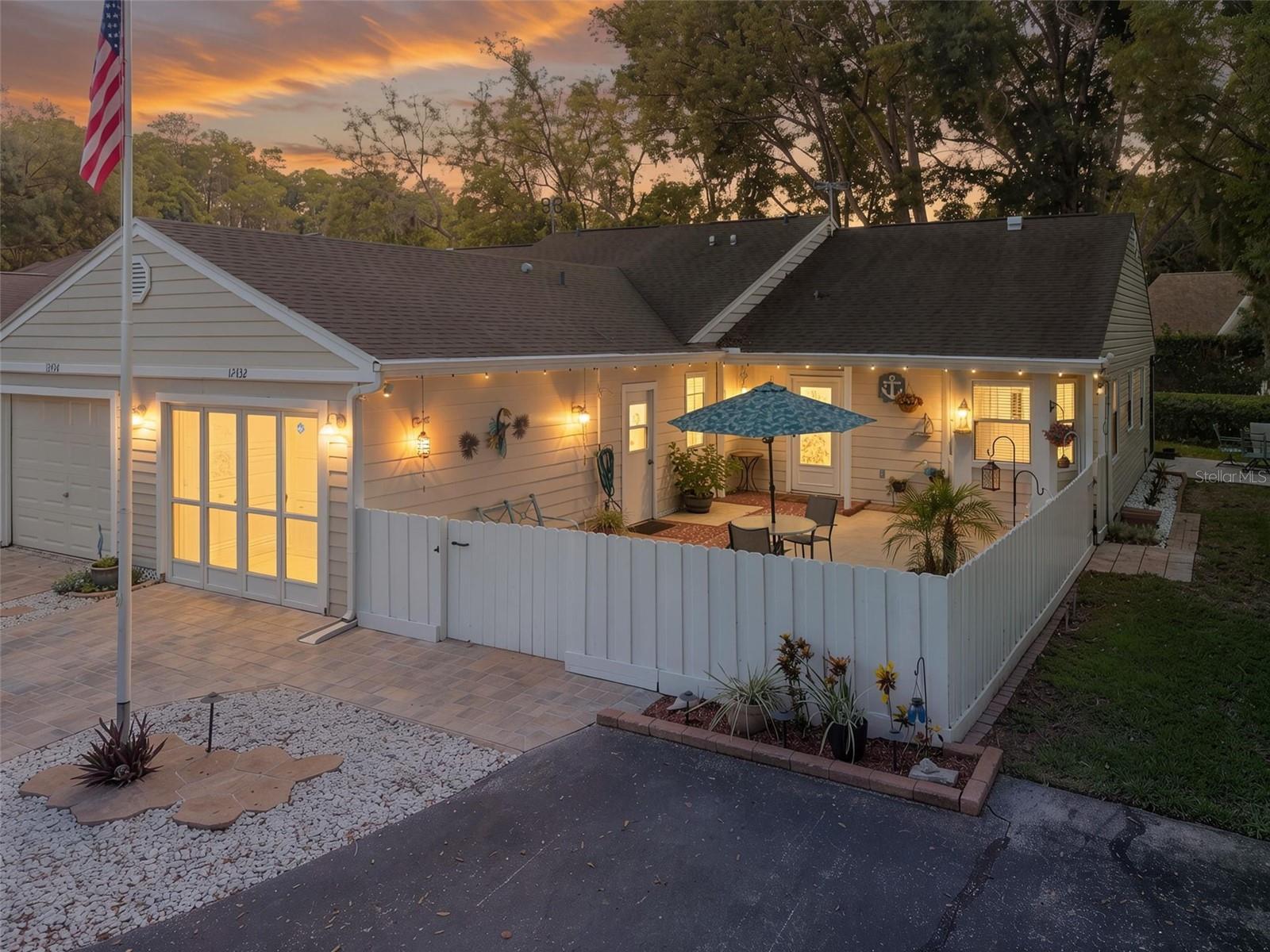 Privacy and tranquility abound in this end unit villa that backs up to a conservation area. The interior features a high ceiling in the great room, newer luxury vinyl flooring, the air conditioned Florida room not only adds lots of space but has plenty of windows and a door to the rear patio looking over the wooded space behind you where nature comes to your back door The kitchen was redone to offer more space and provide a breakfast bar and a dinette area overlooking the fenced in courtyard. The great room also has space for a formal dining room if you wish. Part of the remodel was to add granite counter tops in the kitchen, dinette and primary bathroom. The primary bedroom has both a walk in closet and a full size linen closet with it’s own private bathroom that has a large low entry shower. The split floor plan has the second bedroom and bathroom on the other side of the unit The second bedroom has a door to the garage so you don’t have to go outside on a rainy day to get in your car or to do laundry. The garage door also has a screen to let in the breeze if you are working on the work bench or doing laundry. This all age community features a pool and low monthly HOA fees.