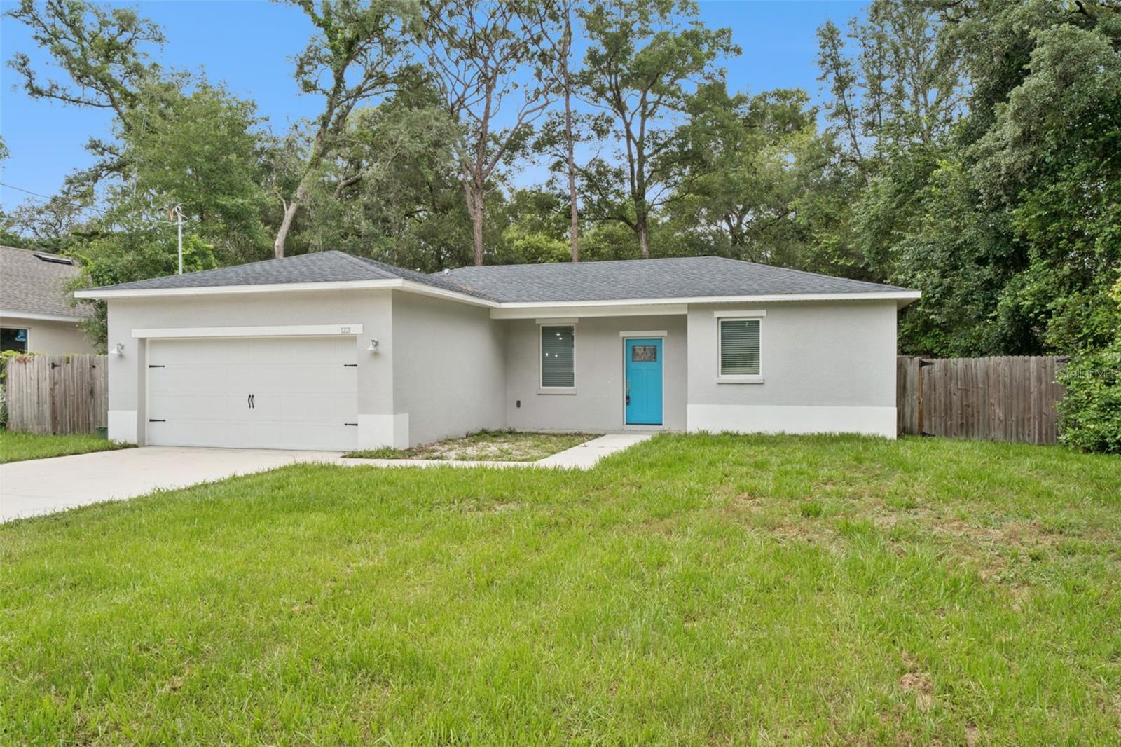 NEW ON THE MARKET! NO HOA. Welcome to this beautifully maintained 3-bedroom, 2-bathroom single-story home built in 2021 and located in Orange City with no HOA. This move-in-ready home offers a desirable split-bedroom floor plan, a 2-car garage, neutral finishes, tile flooring throughout, and an open-concept design perfect for everyday living and entertaining.

The kitchen overlooks the spacious living room and features Whirlpool stainless steel appliances, a pantry, and a breakfast bar. The private primary suite includes a walk-in closet, dual sinks, and a shower with a built-in bench.

Step outside and enjoy the Florida lifestyle from the covered patio, enhanced with Tremron Glacier pavers, a fire pit area, wood privacy fencing with double-gate access, a spacious side yard, and a large backyard offering plenty of room for outdoor activities, pets, or future enhancements.

Additional features include an indoor laundry room and a convenient location near shopping, dining, parks, schools, and major highways. This home is available for a quick closing. Schedule your private showing today!