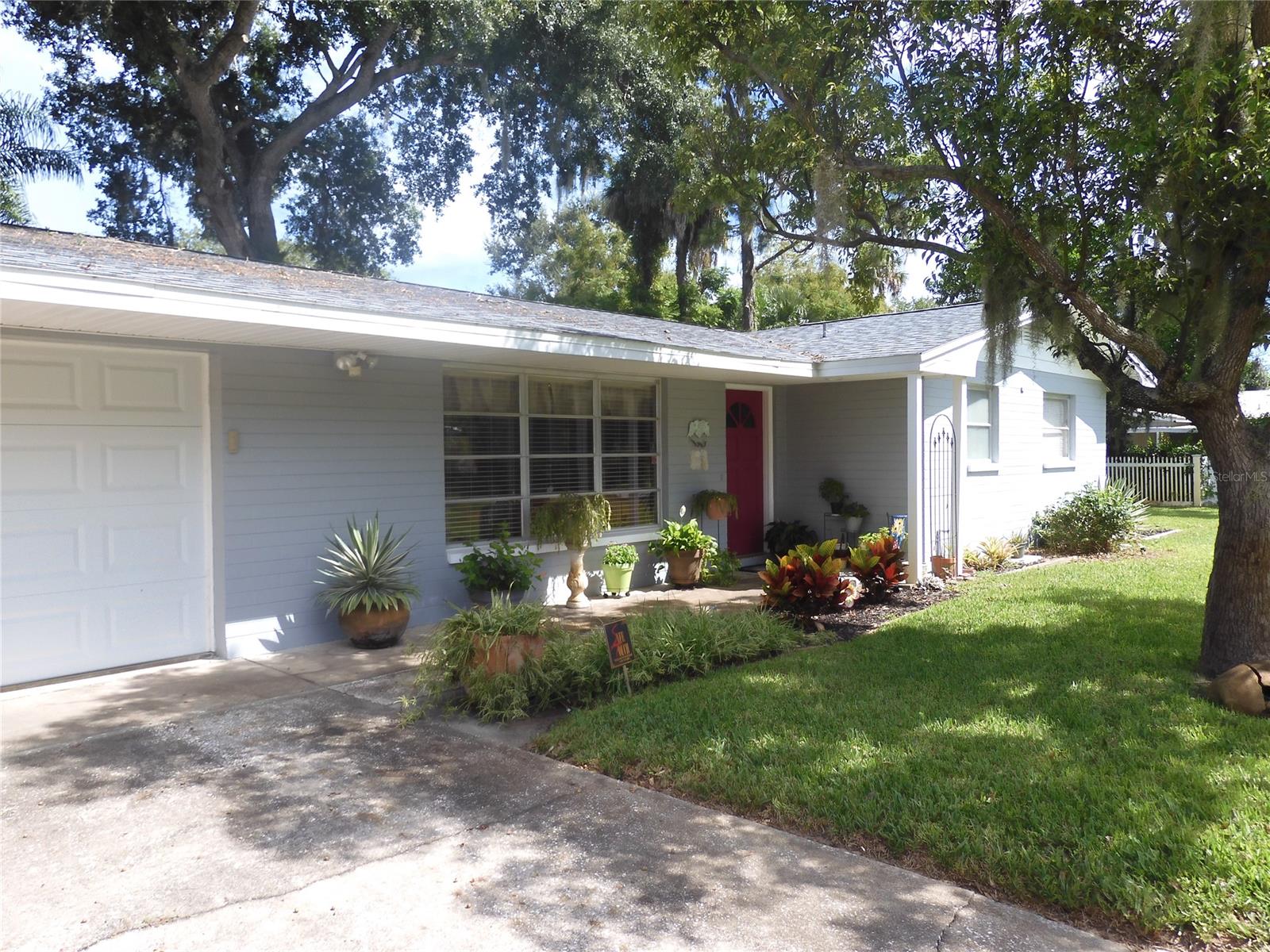 Charming & immaculate block home between US1 & the River situated on a large 120x100 tropical landscaped tree shaded lot! This well built 2BR/2BA/2GAR home is only 3 houses to the River, 5 blocks from the New Smyrna Beach line & 1/2 mile to a Riverfront park & boat ramps. Spacious open floorplan with beautiful parquet wood floors & tile in the kitchen & baths & screened porch. Upgrades in 2019 include roof & insulation, A/C system, Stainless appliances, entire screened porch, plumbing & freshly painted inside & out. Double garage is currently used as a one car garage, plus a workbench area great for tools & hobbies & an office/storage/den area which is air conditioned. This room could be a 3rd bedroom & since the utility room is next door, another bath could possibly be put in. Sprinkler system with well & pump make it easy to maintain this Key West style setting! Detached storage building is 12.8 & 8.2 & offers extra space for lawn equipment, golf clubs, beach gear & fishing equipment. Situated on a quiet street surrounded by nice homes & great neighbors. Start enjoying the Florida lifestyle today in this fantastic home! ;Water: City