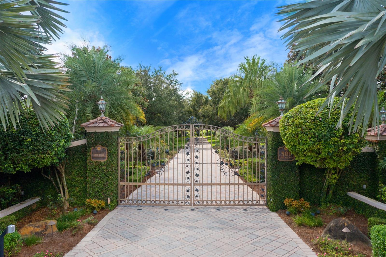 PRICED ADJUSTMENT ~ NOW OFFERED AT $4,800,000 FROM THE APPRAISED VALUE OF $6,250,000  

This exquisite estate awaits the discerning buyer in Auburndale. Nestled on 44.30 lushly landscaped acres with over 2,300 feet of water frontage, this picturesque property is truly a piece of paradise. Beauty abounds upon arrival, from the grand circular driveway and water fountain to the verdant vegetation in the front yard. Enter the solid mahogany doors to a gracious interior comprised of 9,215 square feet of luxurious living space. The foyer is adorned with a free-standing spiral staircase with hardwood steps, along with a marble compass-medallion floor detail and a double tray ceiling. Meticulously designed for the chef at heart, the light and bright kitchen boasts two wall ovens, a warming drawer, Sub-Zero refrigerator, Miele dishwasher, a six-burner Thermador gas range and an eat-in area. For special occasions, the formal dining room is flooded with natural light and features a crystal chandelier. Gather with loved ones in the family room, complete with a custom built-in fireplace and woodwork. For your secluded escape, the master suite is a resplendent retreat with a butler’s pantry, a dressing area with vanity, as well as access to the oversized terrace. The suite also includes dual walk-in closets and separate baths, one with a steam shower and the other with a Jacuzzi tub, walk-in shower and gas fireplace. With four more bedrooms, a study with a full bath and closet which could also be used as a secondary primary suite, a one-bedroom, one-bath in-law suite with a private entrance, there is plenty of space to accommodate guests. This remarkable residence also features a formal living area with a saltwater aquarium, a game room with a wet bar and a sauna. For peace of mind, the home is equipped with two septic tanks, two wells, a water softener system, seven air-conditioning units with two recently replaced, a central vacuum, and programmable lights both inside and out. Store your prized possessions in the gorgeous two-car garage, offering a tiled floor, cherry wood walls and ceilings. An additional two-car guest garage is available for more storage. The outdoors encompasses an opulent oasis featuring a palatial pool with a waterfall edge. For your recreational pursuit, make your way to the tennis courts or private, covered boat dock. A gardener’s garage and pumphouse can also be found on site. Steeped in beauty and capturing panoramic views throughout, this hidden gem presents an exceptional opportunity. Possibility or short term seller financing - terms to be discussed.  For a video tour click or copy paste https://www.youtube.com/watch?v=3-yTELW5xyY Room Feature: Linen Closet In Bath (Primary Bedroom).