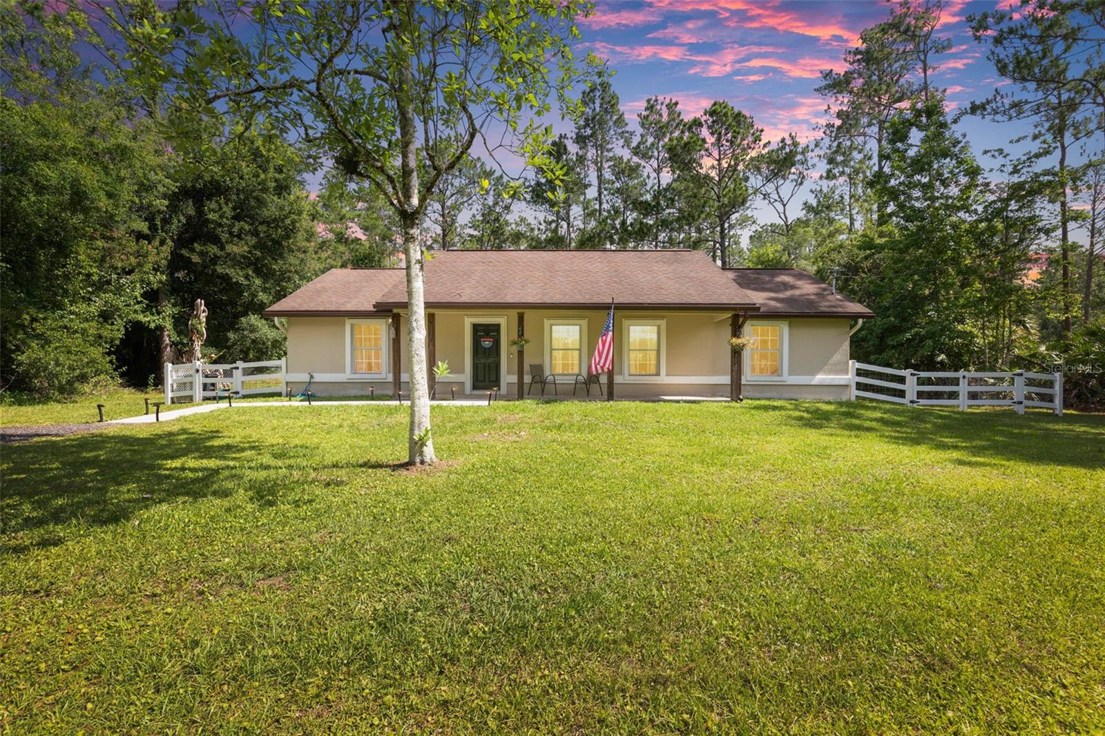 Escape the noise and discover the peace, privacy, and freedom that country living was meant to offer. Nestled on 1.14 high-and-dry acres in Flood Zone X, this concrete block 3-bedroom, 2-bath home gives you the rare opportunity to truly spread out and live life your way—with no HOA and no property restrictions. Bring your RV, boat, trailers, animals, and all your outdoor hobbies with room to spare.

Surrounded by peaceful wooded views, this property feels like your own private retreat. Enjoy quiet mornings on the beautiful front porch, relaxing evenings under the stars, and the kind of calm and privacy that’s becoming harder and harder to find. Inside, the home features fresh paint and luxury vinyl plank flooring throughout for a clean, updated feel, while outside you’ll find a customized lifetime warranty fenced backyard, double loft storage shed, and water softener system already in place.

Finding a concrete block home on over an acre of land at this price point is becoming increasingly rare—especially one that offers this much freedom, privacy, and potential. Properties like this do not last long, so don’t miss your chance to own your own slice of peaceful country living before it’s gone.
