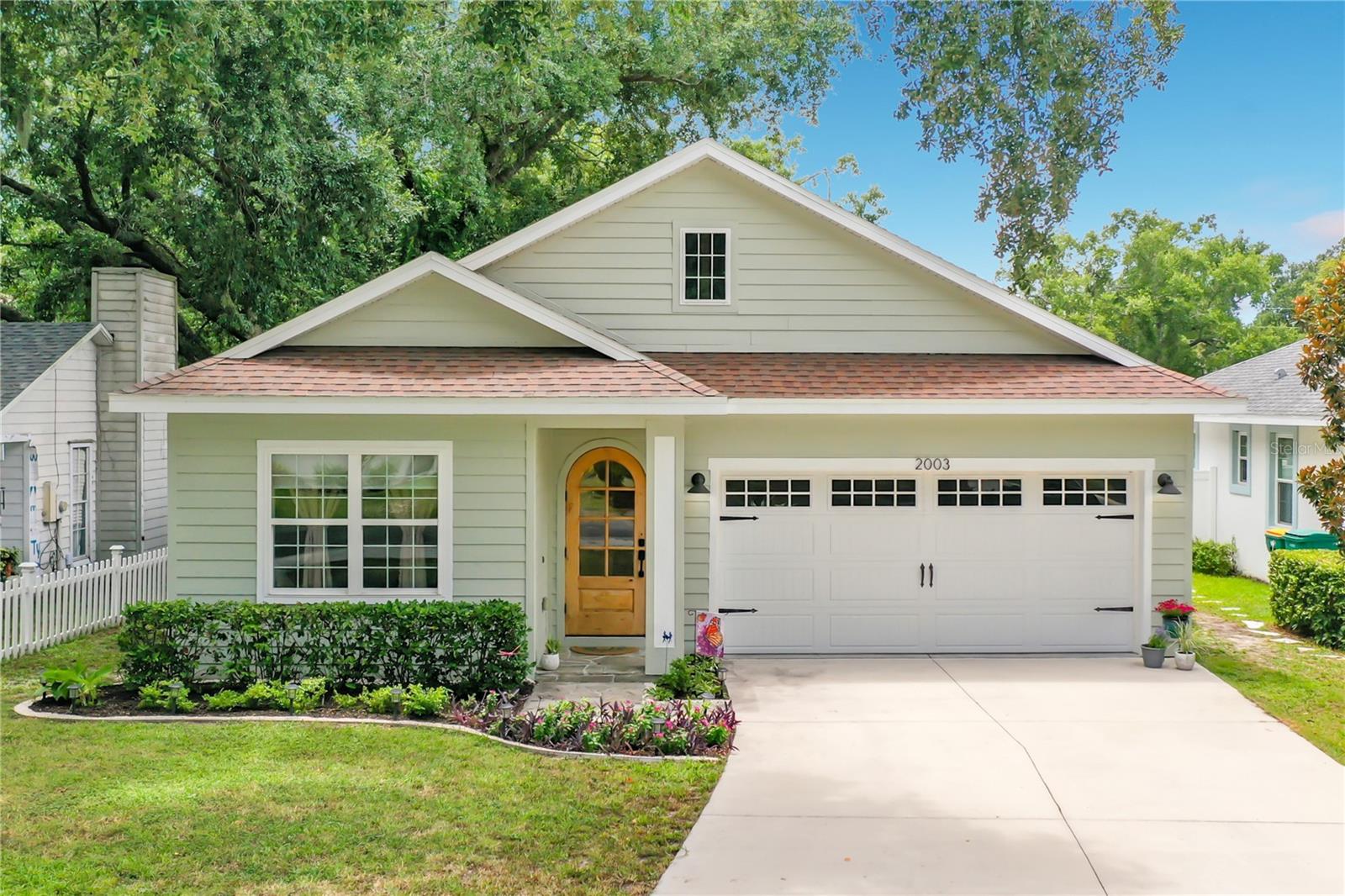 Welcome home to this beautifully appointed 3-bedroom, 2-bath residence, built in 2019, offering the perfect blend of style, comfort, and convenience. Nestled in a charming, golf cart-friendly neighborhood, this home is ideally located close to vibrant downtown Mount Dora, the public library, and just minutes from US-441, providing easy access to shopping, dining, entertainment, and commuting—all with no HOA.

Inside, the open-concept floor plan creates an inviting space for both everyday living and entertaining. You'll find luxury vinyl plank flooring throughout, elegant Craftsman-style trim, and abundant closet space designed for everyday functionality. The thoughtfully designed kitchen features all-wood cabinetry, leathered granite countertops, and gas appliances, while a tankless water heater provides energy-efficient, endless hot water. Both bathrooms are beautifully finished with quartz countertops and timeless marble flooring, adding a touch of luxury to the home's well-appointed interior.

Step outside to your own private retreat with a fully fenced backyard featuring low-maintenance turf, a flagstone patio, and a handcrafted swing set—creating the perfect space for relaxing, entertaining, or enjoying time outdoors. The semi-finished, air-conditioned 2-car garage offers exceptional flexibility for a home gym, workshop, hobby space, or additional storage.

This move-in-ready home combines modern construction, quality finishes, thoughtful upgrades, and an unbeatable location in one of Central Florida's most desirable communities. Don't miss your opportunity to enjoy the Mount Dora lifestyle in this exceptional home!
