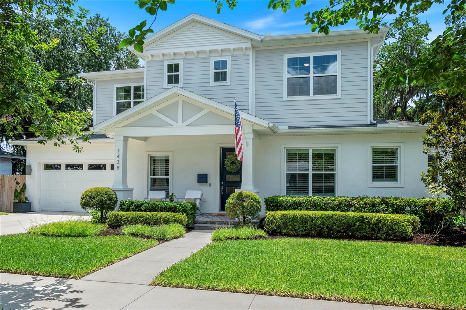 Discover sophisticated style and functional luxury in this meticulously maintained 4-bedroom, 3.5-bath newer-construction residence (built in 2019). Situated on an oversized 75' x 136' wide lot beneath a canopy of mature oak trees, this home sits in the vibrant heart of College Park—just a short stroll from local playgrounds, the highly desirable Packing District and the YMCA.

Spanning 2,875 heated square feet, the open-concept layout is centered around an impressive 8'4" oversized kitchen island that flows seamlessly into the sun-drenched family room. Upgraded lighting (2023) and beautiful plantation shutters illuminate the main floor, which thoughtfully hosts two primary suites. The main primary retreat feels like a private spa, complete with dual walk-in closets and an expansive frameless glass shower. Upstairs, a versatile flex space awaits, perfect for a media, bonus, or playroom. Also, 2 bedrooms and a large, dual sink bathroom are situated on the second level. 

Effortless indoor-outdoor entertaining shines through massive sliding glass doors that open to a spectacular, 380-square-foot covered lanai. The sprawling backyard features newly updated tropical landscaping (2025/2026), full perimeter fencing, a French drain, and whole-house gutters. Complete with a custom mudroom build-out (2024), a brand-new garage door and system (2025), security cameras, and a freshly washed exterior, this turn-key masterpiece is ready for its next chapter.