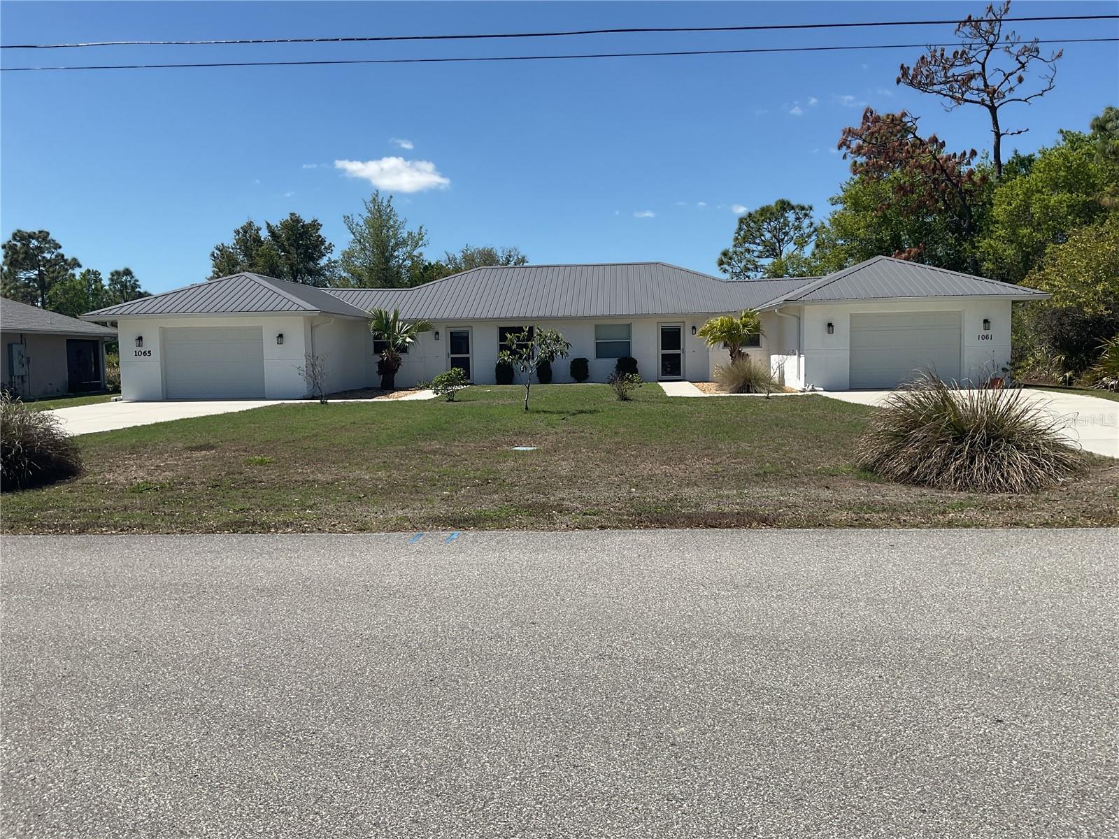 Located in the highly sought-after Deep Creek community of Punta Gorda, this well-maintained, fully occupied duplex at 1061 Nomad Rd presents an outstanding investment opportunity for both seasoned investors and owner-occupants looking for immediate cash flow.Situated within a desirable school district, this income-producing property offers the perfect blend of location and value. With both sides currently rented, it delivers immediate, reliable revenue from day one. Each unit features a spacious 2-bedroom, 2-bathroom layout with approximately 1,065 square feet of living space, complete with central air, updated interiors, and functional floor plans designed for comfortable living. Additional tenant-pleasing highlights include private lanais, in-unit laundry hookups, and attached garage spaces.Whether you choose to keep both sides leased for maximum rental yields or eventually transition to a house-hacking strategy by living in one side while the tenant helps pay your mortgage, this property offers incredible long-term flexibility. Located just minutes from I-75, shopping, dining, and local amenities, it provides ultimate convenience in a quiet residential setting.Don’t miss out on this exceptional turnkey duplex—ideal for building equity, generating strong rental income, and securing your piece of Southwest Florida real estate!