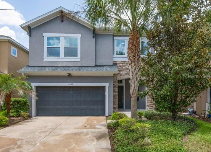 FORMER DAVID WEEKLEY SHOWCASE HOME located in highly sought-after FishHawk Ranch West! Situated on a wonderful, fully fenced homesite, this stunning David Weekley "Sandpiper" offers 2,628 square feet of beautifully designed living space featuring 4 bedrooms, 3.5 bathrooms, a spacious loft, and an open-concept floor plan ideal for everyday living and effortless entertaining. Outstanding curb appeal welcomes you with attractive landscaping, stone accents, and a charming Craftsman-style elevation. Inside, soaring foyer ceilings, abundant natural light, and gorgeous wood-look tile flooring throughout the first floor create an inviting atmosphere. The chef-inspired gourmet kitchen is the heart of the home, showcasing 42-inch cabinetry with crown molding, granite countertops, subway tile backsplash, a large center island with decorative pendant lighting, walk-in pantry with shelving, and generous dining and gathering spaces. Sliding glass doors lead to the covered, screened lanai overlooking the expansive fenced backyard—a rare find with plenty of room to play, relax, or entertain. Upstairs, premium engineered hardwood flooring flows throughout the loft and bedrooms, where a desirable three-way split floor plan offers privacy for everyone. The luxurious owner's retreat features a spacious walk-in closet and spa-like en-suite bath complete with dual granite vanities, a soaking tub, and a glass-enclosed shower. Bedrooms 2 and 3 share a convenient Jack-and-Jill bath with dual sinks, while Bedroom 4 enjoys its own private en-suite bath, making it ideal for guests, teens, or multigenerational living. A generous loft with storage closet provides flexible bonus space, and the upstairs laundry room includes built-in shelving and a folding station for added convenience. Located within walking or biking distance to top-rated Stowers Elementary and Barrington Middle School, with bus service to Newsome High School, this exceptional home also offers access to FishHawk West's incredible resort-style amenities, including The Lake House with gathering room, billiards, ping pong, state-of-the-art fitness center, community pool, splash park, dog park, playgrounds, parks, and year-round events on Central Park Lawn. Conveniently located just minutes from Downtown Tampa, MacDill Air Force Base, world-class beaches, golf, and Orlando attractions, this extraordinary home truly offers the Florida lifestyle you've been dreaming of. Be sure to review the attached list of upgrades and special features, then schedule your private showing today—this is one you won't want to miss!