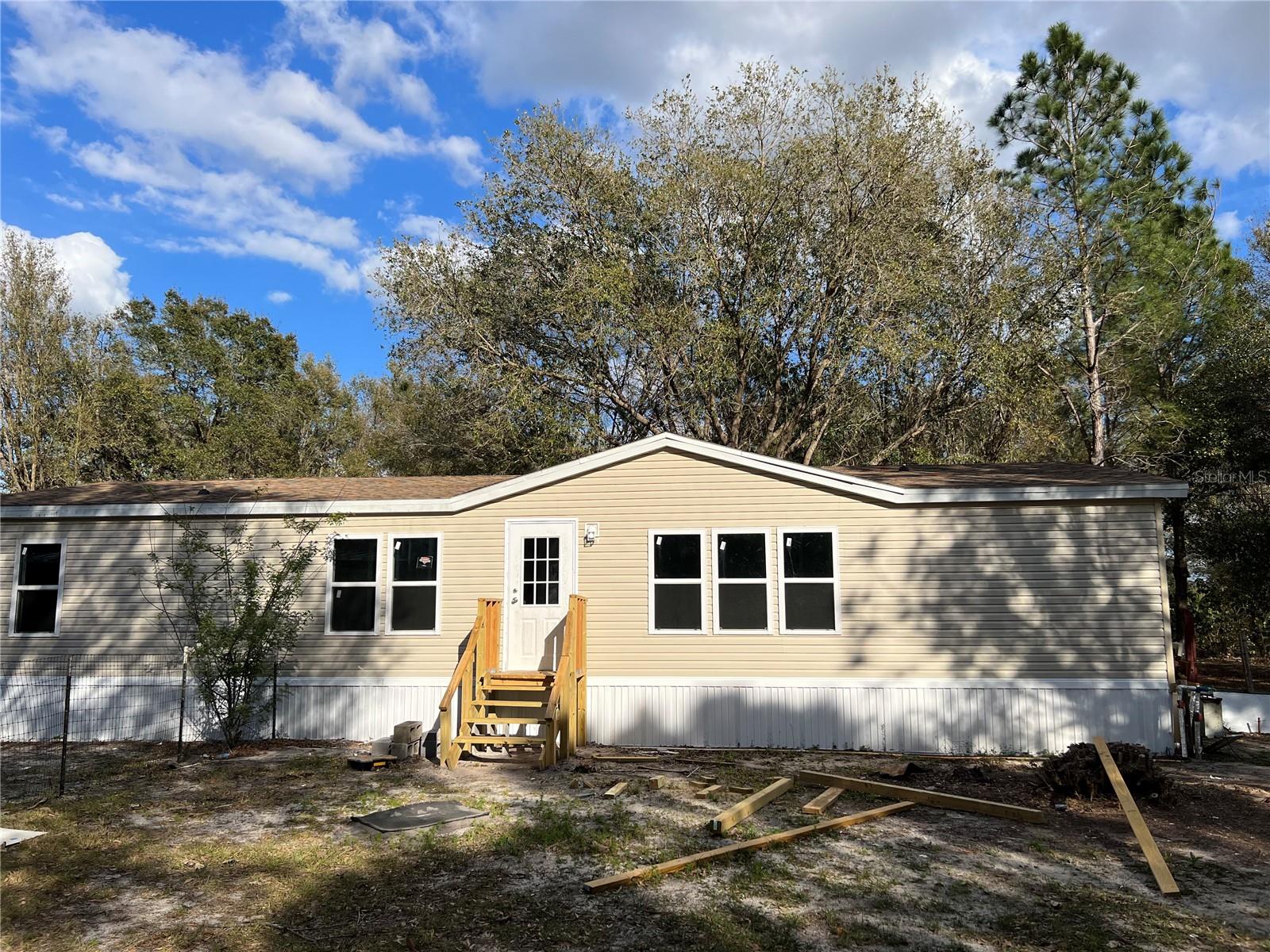 Its spring time ready for a brand newly remodeled home roaming on 1.12 acres fenced lot in a quiet community of about 10 families, around it are orange grove , cattle farms, strawberry plantations.  Minutes away from the center of lake Wales there are also a work shop that you can put all your faverate tools, and do your projects, beautiful oak trees and pines in front and back yard.newly painted interiors and new kitchen brand new cabinits that you can call it home.