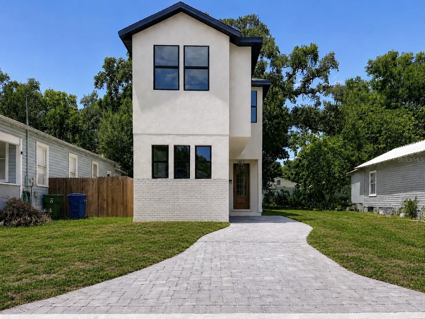 Virtually Staged. Experience contemporary living just minutes from Historic Ybor, Downtown Tampa, and the exciting Gasworx redevelopment, one of Tampa's most transformative mixed-use projects bringing new dining, shopping, entertainment, and walkable green spaces to the area.

This beautifully designed 3-bedroom, 2.5-bath home blends modern style with everyday functionality. The open-concept floor plan features luxury vinyl plank (LVP) flooring, quartz countertops, sleek cabinetry, and abundant natural light. Upstairs, all three bedrooms offer privacy, including a spacious primary suite with a beautifully appointed en-suite bath and generous closet space.

Outside, enjoy attractive curb appeal with a brick paver driveway and low-maintenance new construction designed for today's lifestyle. Built with quality craftsmanship and modern finishes, this home also includes a transferable builder warranty for added peace of mind.

Perfectly positioned in one of Tampa's fastest-growing neighborhoods, you'll be just minutes from Gasworx, Historic Ybor City, Water Street, Channelside, Downtown Tampa, and major interstates, making commuting and enjoying everything Tampa has to offer effortless.
Whether you're searching for your next home or a smart investment opportunity, this move-in-ready property delivers the ideal combination of style, location, and long-term value. Don't miss your chance to own a brand-new home in one of Tampa Bay's most exciting and rapidly evolving communities.