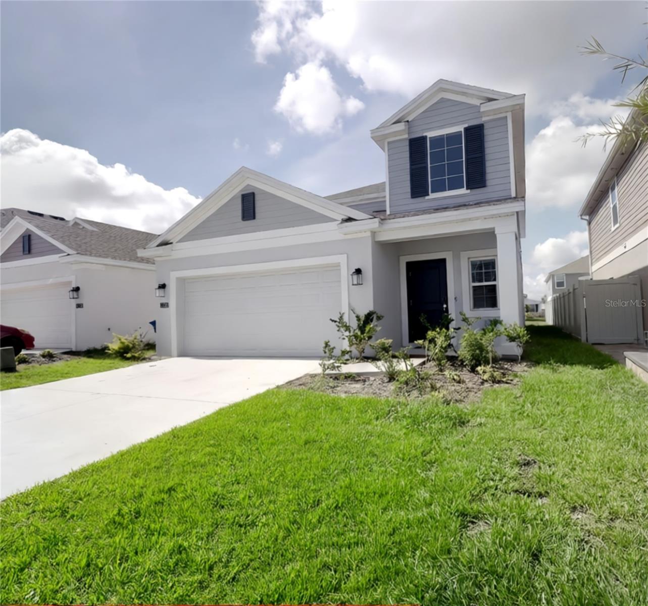 Welcome to this spacious and beautifully designed 5-bedroom, 2-bathroom home nestled in the sought-after Cascades community of Davenport! From the moment you step inside, you'll be greeted by a bright and open floor plan featuring elegant tile flooring throughout the first floor, perfect for easy living and entertaining. The modern kitchen flows seamlessly into the living and dining areas, filling every corner with natural light and a warm, inviting atmosphere. Upstairs, you'll find all five bedrooms, a convenient laundry room, and a versatile open loft area — ideal for a home office, playroom, or cozy retreat. The upper level is finished with stylish laminate/vinyl flooring and staircase, adding warmth and character throughout. The primary bathroom impresses with solid surface countertops and a double vanity, offering a touch of everyday luxury. Step outside to enjoy your generously sized backyard, fully enclosed with a vinyl privacy fence — a safe and private haven for family gatherings, and pets. A concrete open patio completes the outdoor space, ready for your weekend barbecues and relaxing evenings. The 2-car garage provides ample storage and convenience. Located minutes from major highways, shopping, dining, and top-rated schools. This home checks every box for the growing family looking for space, comfort, and community. Don't miss this opportunity!