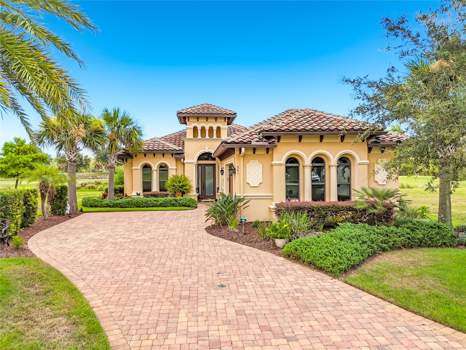 Welcome to luxury golf course living in the esteemed community The Conservatory, an exclusive gated community centered around the renowned Tom Watson Signature 18-hole Golf Course. Perfectly positioned on the 8th fairway with breathtaking views of the lake and the 9th tee box, this beautifully maintained one-owner Gold Coast Homes residence offers an exceptional opportunity to own in one of Florida's premier golf communities featuring TWO championship golf courses.

This meticulously cared-for 3-bedroom, 2-bath home combines timeless elegance with thoughtful upgrades throughout. From the moment you enter, you'll appreciate the soaring tray ceilings, custom crown molding, elegant wainscoting, built-in features, and designer lighting that create a warm yet refined atmosphere. The spacious kitchen is designed for both everyday living and entertaining, showcasing granite countertops, solid wood cabinetry, stainless steel appliances, and the convenience of the washer and dryer included.

The luxurious primary suite features custom-designed closets and a spa-inspired bath with seamless glass shower doors, while both bathrooms have been tastefully upgraded with premium finishes. Electronic remote-controlled shades provide effortless comfort and privacy throughout the home.

Step outside to your own private Florida oasis. The heated and cooled 28' x 16' saltwater pool, complete with a newer pump, is enclosed with a panoramic screen that maximizes the spectacular golf course and water views without obstructing the scenery. Whether enjoying your morning coffee or entertaining guests, this outdoor living space is truly unforgettable.

Additional highlights include a NEW air conditioning system (1 year old), durable tile roof, oversized two-car garage with custom built-in storage, and exceptional pride of ownership throughout.

Residents enjoy 24/7 gated security and have the option to join the magnificent Club At Hammock Beach that proudly features a $40 million clubhouse, offering world-class amenities including a state-of-the-art fitness center, resort-style swimming pool, and an outstanding golf experience. Best of all, you're just minutes from beautiful Hammock Beach, celebrated as one of Florida's most spectacular stretches of coastline.

This is more than a home—it's an extraordinary lifestyle in one of Northeast Florida's most sought-after golf communities. Schedule your private showing today!