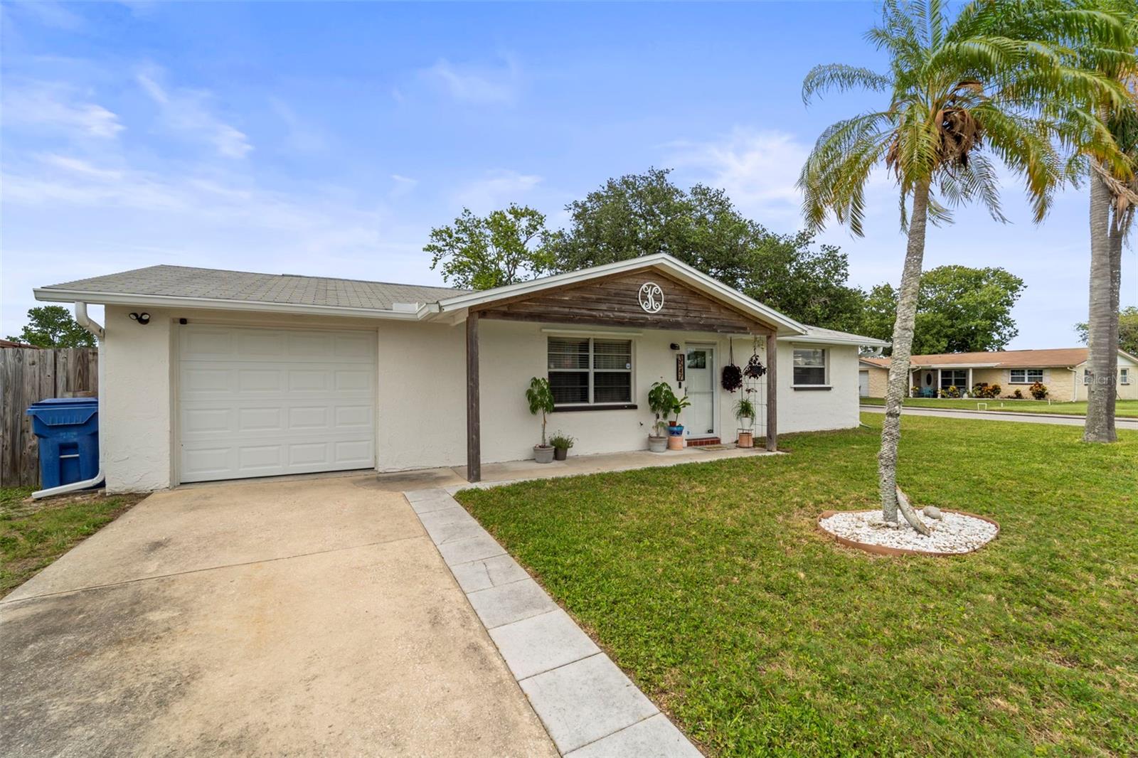 PROPERTY HIGHLIGHTS

• Situated at approximately 14 feet elevation — home and street have NEVER FLOODED, including during the major hurricanes of 2024

• LARGE CORNER LOT WITH NO HOA

• Fully fenced backyard featuring double gate access, allowing convenient boat or trailer storage/access

• Ideally positioned near waterfront parks, Gulf Coast recreation, local restaurants, and outdoor activities

• Approximately 10 minutes to both Downtown Tarpon Springs and Downtown New Port Richey

• Less than 10 minutes from Key Vista Nature Park, offering scenic Gulf views, walking and biking trails, hiking paths, and kayak launch access

• Approximately 20 minutes from Downtown Dunedin

• Convenient access to shopping, dining, entertainment, nightlife, and locally owned coffee shops

INTERIOR & EXTERIOR UPDATES

• New front entry door

• Fresh interior and exterior paint

• Updated modern fixtures throughout the home

• Brand new kitchen appliances installed December 2025

• New washing machine installed in 2026

• Solid surface countertops installed November 2021

• Bathroom remodeled in 2021

MAJOR SYSTEM IMPROVEMENTS

• Complete HVAC system replacement completed October 2021, including condenser, air handler, ductwork, vents, and associated components

• Water heater replaced in 2025

• Roof equipped with hurricane clips, providing additional structural reinforcement between the roof system and exterior masonry walls

• Full set of hurricane shutters included for all windows

ADDITIONAL FEATURES

• Monitored ADT security system

• Keyless front door entry

EXCLUSIONS

• Dining room chandelier and kitchen island does not convey and will be removed prior to closing unless otherwise negotiated.