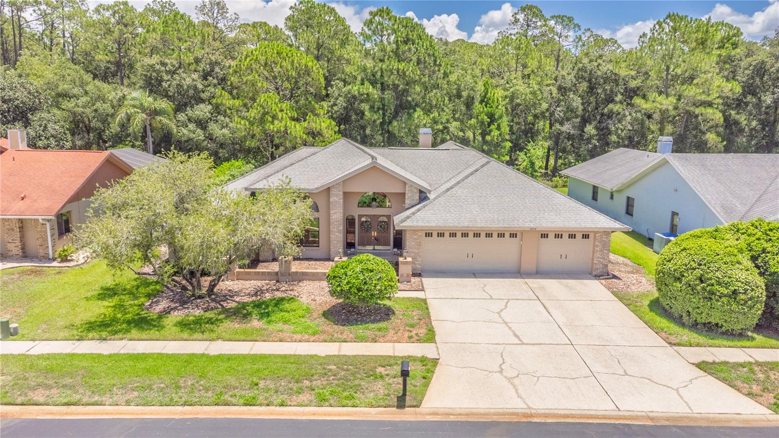 Multiple offers received. Highest & Best offers due by noon on Friday, July 17, 2026. Seller will make a decision by 5 PM Friday. 

EXECUTIVE LIVING MEETS FLORIDA LIFESTYLE IN THE HEART OF PALM HARBOR
Some homes simply offer bedrooms and bathrooms. This home offers a lifestyle.

Nestled within one of Palm Harbor's desirable gated communities, this impressive 4-bedroom, 3-bath executive pool home offers 3,154 square feet of living space, a 3-car garage, a private executive office with custom built-ins, and an expansive split-bedroom floor plan designed for both everyday living and effortless entertaining.

From the moment you step through the double-door entry, soaring ceilings, oversized windows, and light-filled living spaces create an immediate sense of openness. The formal living and dining areas and spacious family room make this home equally suited for intimate evenings or large gatherings.

At the heart of the home, the generously sized kitchen offers abundant cabinetry, granite countertops, breakfast bar, stainless steel appliances, and an adjoining wet bar—perfect for entertaining. The granite is truly one-of-a-kind, creating a distinctive focal point that adds character and conversation to the space.

The oversized primary suite is a private retreat featuring direct access to the lanai, walk-in closet, and a spacious ensuite bath with dual sinks, a soaking tub, walk-in shower, and private water closet. Three additional bedrooms provide flexibility for family, guests, or hobbies, while the dedicated office with custom built-in shelving offers an ideal work-from-home space.

This is the backyard buyers dream about. With no feeling of being boxed in by neighboring homes, the lush landscaping creates a peaceful, private setting where you can unwind by the pool, entertain friends, or simply enjoy the quiet beauty of Florida living.  Worth mentioning is the oversized 3-car garage with storage closet and 11x9 space that would accommodate all your extra toys and tools.

Lovingly maintained over the years, this home features numerous improvements, including a kitchen remodel with granite countertops and cabinetry, updated primary and a guest bathroom, updated flooring, interior paint, lighting fixtures, interior doors and hardware (2018), updated kitchen appliances including refrigerator (2021), range (2020), dishwasher (2020), microwave (2023), garbage disposal (2021), and faucet (2020), a 2023 water heater, pool filter (2025), new pool heater and pool pump (2026), water softener and reverse osmosis system (2026), new double garage door opener (2025), updated components for the single garage door opener (2025), along with annual HVAC servicing, plumbing inspections, and dryer vent cleanings that reflect the pride of ownership throughout.

For additional peace of mind, the seller may consider replacing the roof and HVAC system with an acceptable offer and agreeable terms, providing buyers the opportunity to secure significant value on two major components of the home.

Ideally located near top-rated schools, championship golf courses, John Chesnut Sr. Park, Lake Tarpon, the Pinellas Trail, shopping, dining, medical facilities, and the Gulf beaches, this exceptional home combines generous living spaces, thoughtful updates, and an outstanding Palm Harbor location.

This isn't just another home on the market—it's where your next chapter begins.