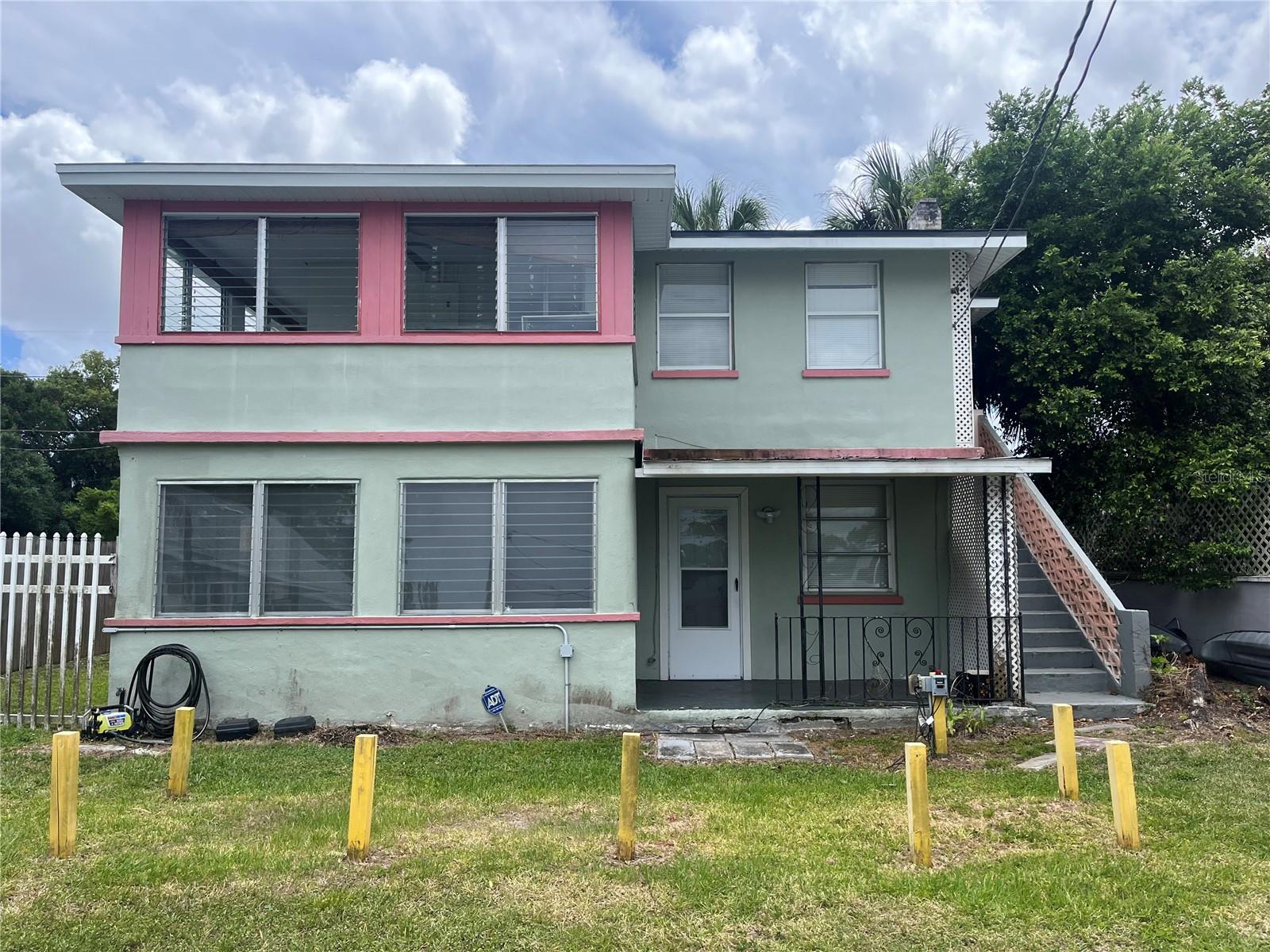 Prime location in Winter Park with view of Lake Killarney. Build home of your dreams with a view of the lake or keep exiting duplex as rental property. No HOA.