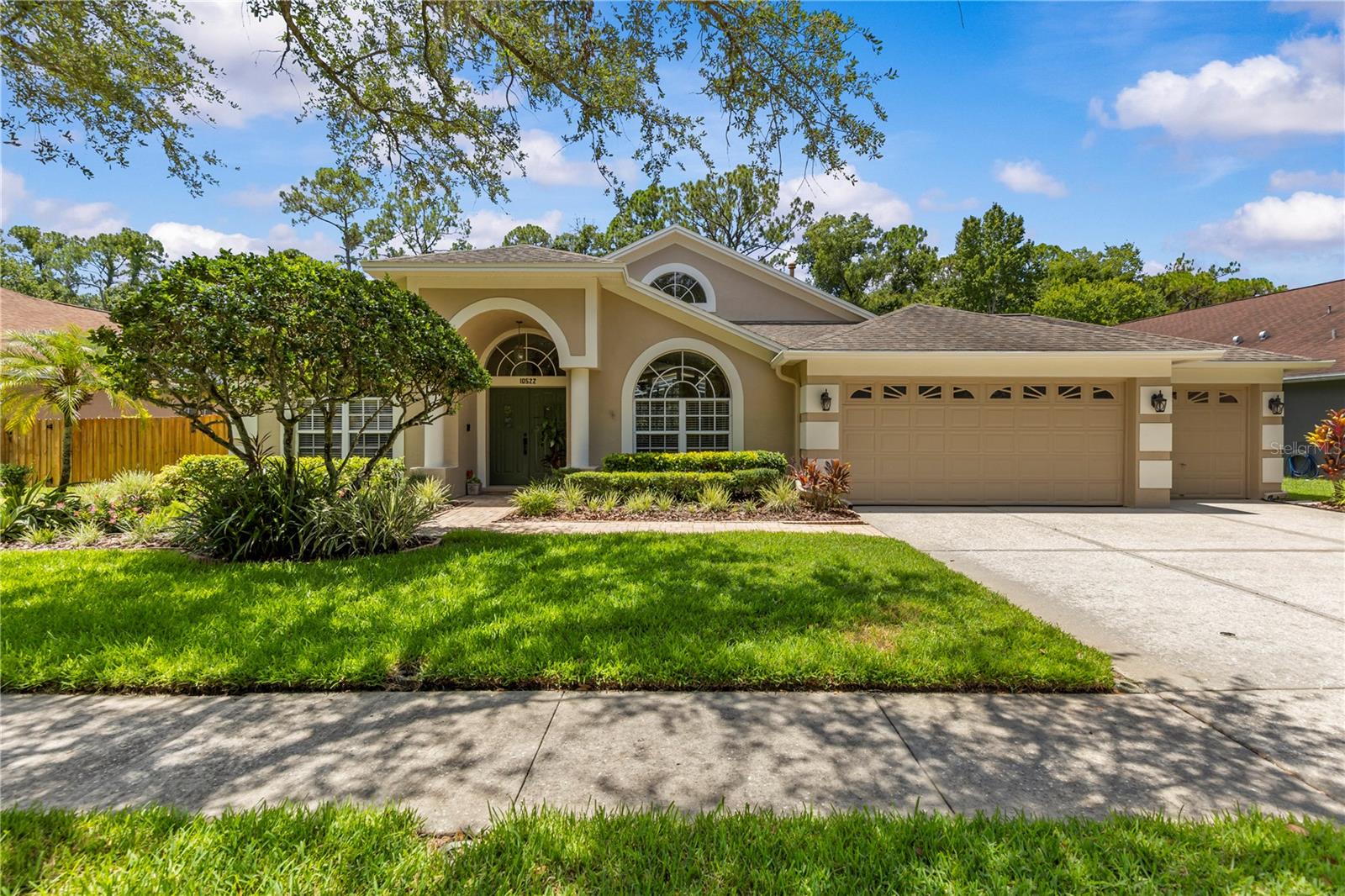 If space, lifestyle a newly updated move-in ready home is what you’re looking for, then this is THE ONE! This gorgeous Westchase home offers a rare find of over a 1/4-acre lot. All rooms and entryway are large. (See photos and measurements). The property lot line extends further past the privacy fence…but no worries, the huge side yard is fully fenced for Fido. The saltwater pool with spillover spa overlooks a beautiful conservation area which means no rear neighbors. Inside offers a split bedroom floor plan. The spacious family room overlooks the backyard and pool through the floor to ceiling windows and newer (2018) oversized triple glass sliding door that retract in the wall bringing the outdoor inside. The kitchen is a show stopper with its approx. 25 ft soaring ceiling at its highest peak and half-moon window. It’s been freshly updated (2026) with new cabinets, fixtures, granite countertops and refrigerator. Need kitchen storage space? There are 2 pantry’s, one which is a walk-in with an elfa storage system. In the front of the home there is a formal living and separate dining room. The primary bedroom has a builders upgraded in-suite private flex room and tall triple dead bolt locking French doors (2018) that leads to the pool/lanai area. Seller uses the flex room as an office. (see photos). All windows in the primary and flex room are hurricane rated (2021). There are 2 walk-in closets, brand new carpet (2026). The primary bathroom was custom designed and offers cherry wood cabinets, a jetted tub (motor replaced 2026). A separate shower and private water closet. The other 3 bedrooms are also very spacious. The 4th bedroom offers a walk-in closet and its own private bathroom with a door leading to the pool/lanai area. The 2nd and 3rd full baths were updated in 2026. (see photos).  Indoor laundry room has lots of storage cabinets and a tub sink and counter top. Gas or electric hook-up. The home exterior was freshly painted Nov. 2025. Interior walls, baseboards, doors and garage all freshly painted (2026). New landscaping (2026). Owned water softener. All new door handles and door hinges (2025). The HVAC is a 5-ton Rheem (2020) with an added ionizer to filter in fresh air and UV light. Roof has a secondary water barrier. Tile grout was resealed (2026). Neighborhood amenities include: 2 pools, splash pad, 2 parks, basketball, tennis and pickleball courts, activity field, walking trails, shopping, restaurants, retail, 18 hole public golf course, movies in the park and much more. Visit the community website for additional details at www.westchasewca. No flood insurance required. If you’ve made it this far, what are you waiting for? Schedule your showing today!