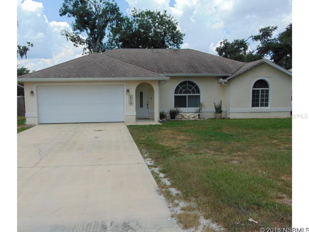 Available August 1st - Three bedroom two bath  home with split floor  plan home and vaulted ceilings and  privacy fenced yard for your children and pets to play, there is even a playset. Screened porch off the dining area and a two car garage . Stainless steel appliances. Conveniently located a short drive from New Smyrna Beach Middle School and New Smyrna Beach High School and just a short drive to the beach.