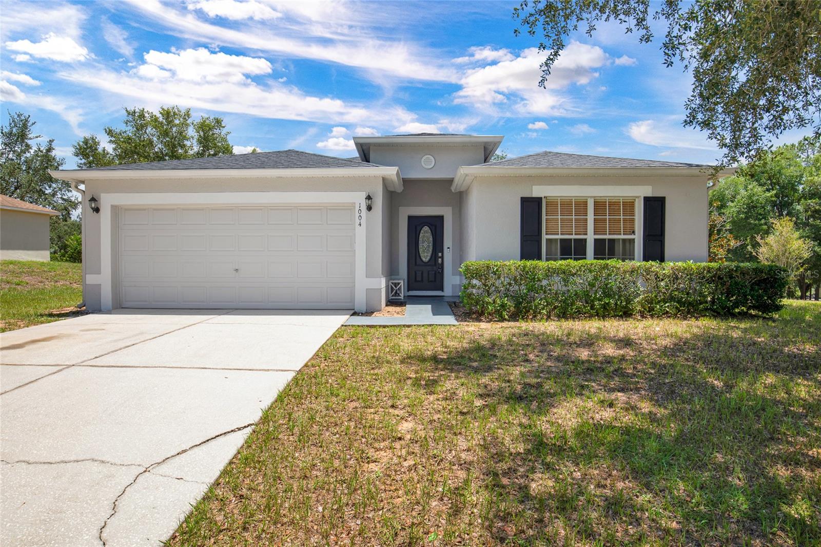 Welcome home to this spacious 4-bedroom, 2-bath residence ideally situated on a desirable corner lot in Minneola! Designed with both comfort and functionality in mind, this home offers multiple living areas, including a formal living room, separate family room, and dining room—providing plenty of space for entertaining. The spacious kitchen features a breakfast bar, ample cabinetry, and a sunny eat-in dining area, making it the perfect gathering place for family and friends. The split, open layout offers flexibility for a variety of lifestyles. Enjoy Florida living year-round from the screened patio overlooking the backyard. Additional conveniences include an inside utility room and an attached 2-car garage, providing plenty of storage and workspace. ROOF 2021 Conveniently located near shopping, dining, schools, parks, major highways, and the Clermont chain of lakes, this home offers the perfect combination of space, comfort, and location. Don't miss your opportunity to make this beautiful Minneola home your own!