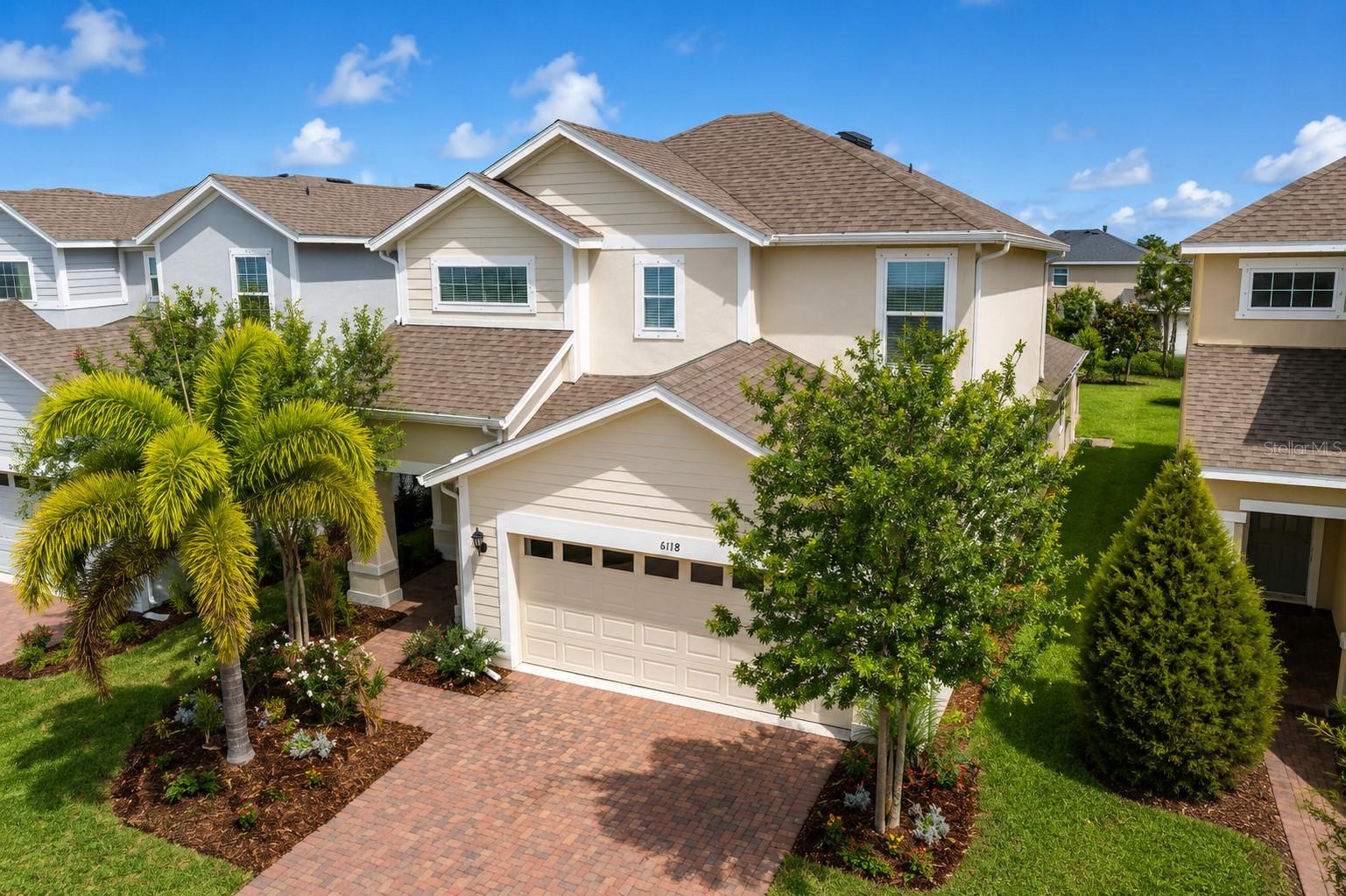 Welcome to 6118 Voyagers Place in the highly sought after Waterset community of Apollo Beach.
This beautifully maintained 4 bedroom, 2.5 bathroom home offers over 2,100 square feet of thoughtfully designed living space with the primary suite conveniently located on the first floor. Built in 2020, this home combines modern comfort, functional design, and exceptional outdoor living.

The upgraded kitchen features premium cabinetry, stone countertops, stainless steel appliances, and an open layout that flows seamlessly into the main living areas, making it perfect for everyday living and entertaining.

Upstairs, you'll find a spacious loft ideal for a home office, media room, playroom, or additional living space, along with three generously sized bedrooms.

Step outside to your private backyard retreat featuring an oversized paver patio, custom outdoor bar, grill station, wine refrigerator, beer kegerator, fire pit, and beautifully landscaped yard designed for relaxing evenings and unforgettable gatherings.

Living in Waterset means enjoying resort style amenities including multiple pools, waterslides, fitness centers, walking trails, dog parks, playgrounds, tennis courts, pickleball courts, clubhouse, café, and year round community events.

Conveniently located near I 75, downtown