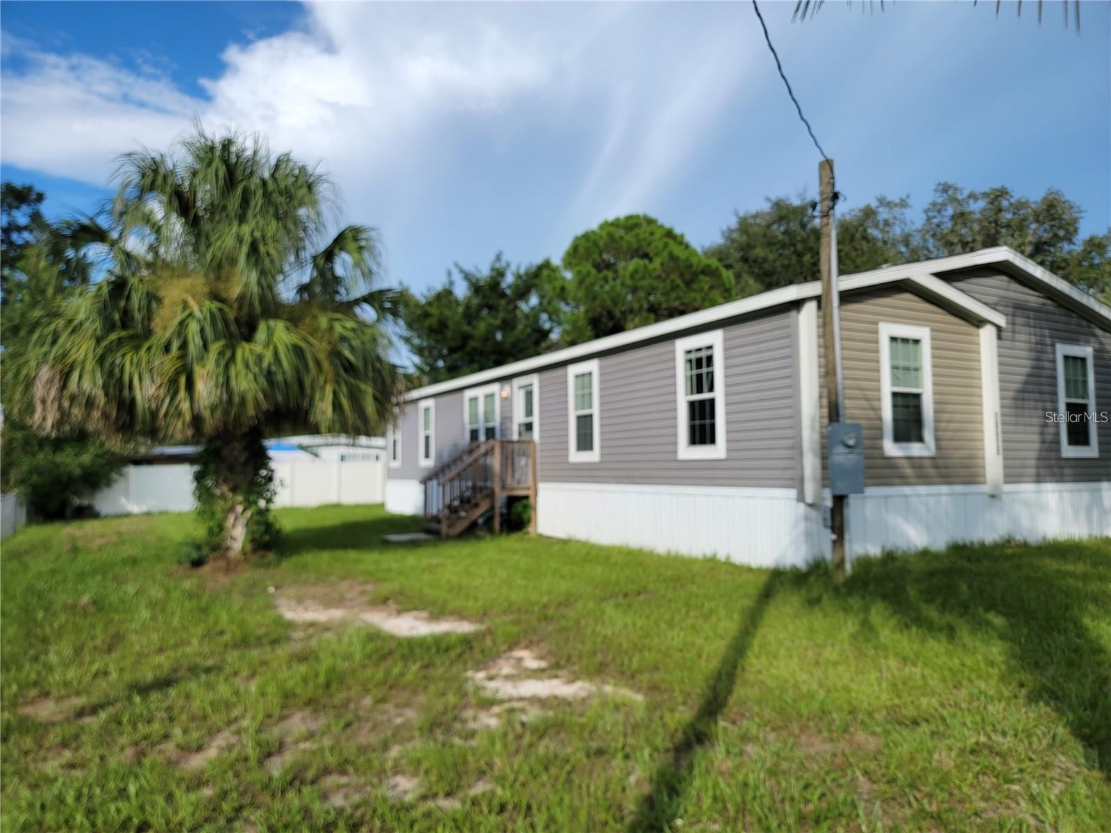 Now Available for Rent! This spacious 4-bedroom, 2-bath mobile home offers over 2,600 square feet of comfortable living space with a bright, open floor plan perfect for everyday living and entertaining. The expansive kitchen is the heart of the home, featuring a large center island, abundant cabinet space, and plenty of room for meal prep and gathering with family and friends.

Luxury vinyl plank (LVP) flooring flows throughout the home, providing a modern look with easy maintenance. The oversized primary suite offers a private retreat with a generous walk-in closet and plenty of space to unwind. Three additional bedrooms provide flexibility for family, guests, or a home office.

Conveniently located close to shopping, dining, schools, and everyday amenities, this home combines space, comfort, and convenience. If you're looking for a roomy rental with modern features and an ideal location, this one is a must-see. Schedule your private showing today!