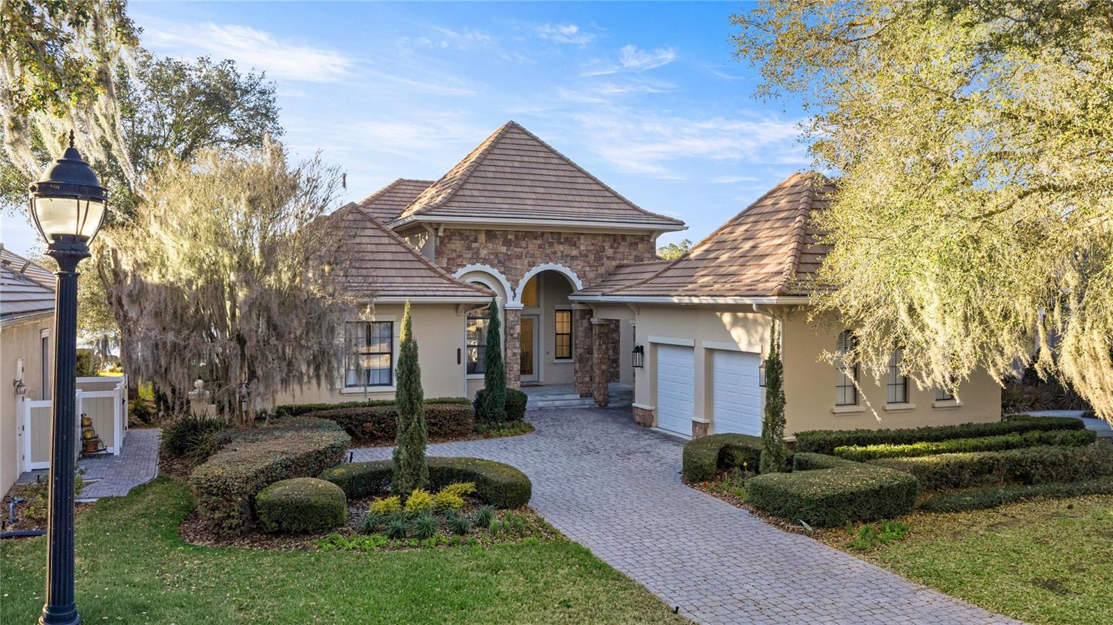 Located within the World-class community of Golden Ocala Golf & Equestrian Club, this light-filled residence offers a rare and breathtaking water view with abundant wildlife visible from nearly every room. Just steps from the Golden Ocala Spa and Tennis/Fitness Center, the home delivers an exceptional resort-style lifestyle in one of Ocala's most sought-after communities.

Elegant finishes and refined architectural details define the interior, including spectacular onyx flooring, exquisite molding, and rich wood paneling throughout. The gourmet kitchen features Viking appliances with gas cooking and a striking molded stone range hood that mirrors the dramatic molded stone surround on the living room fireplace.

The spacious primary suite is a serene retreat, highlighted by a grand bay window overlooking the water- a stunning backdrop for morning light and evening sunsets.

Designed for both everyday comfort and upscale entertaining, the private patio showcases a built-in summer kitchen and tranquil water views. The yard is fenced for fur babies, offering both privacy and peace of mind.

Ideally positioned just a golf cart ride from the World Equestrian Center, offering seamless access to Ocala's premier equestrian venue.