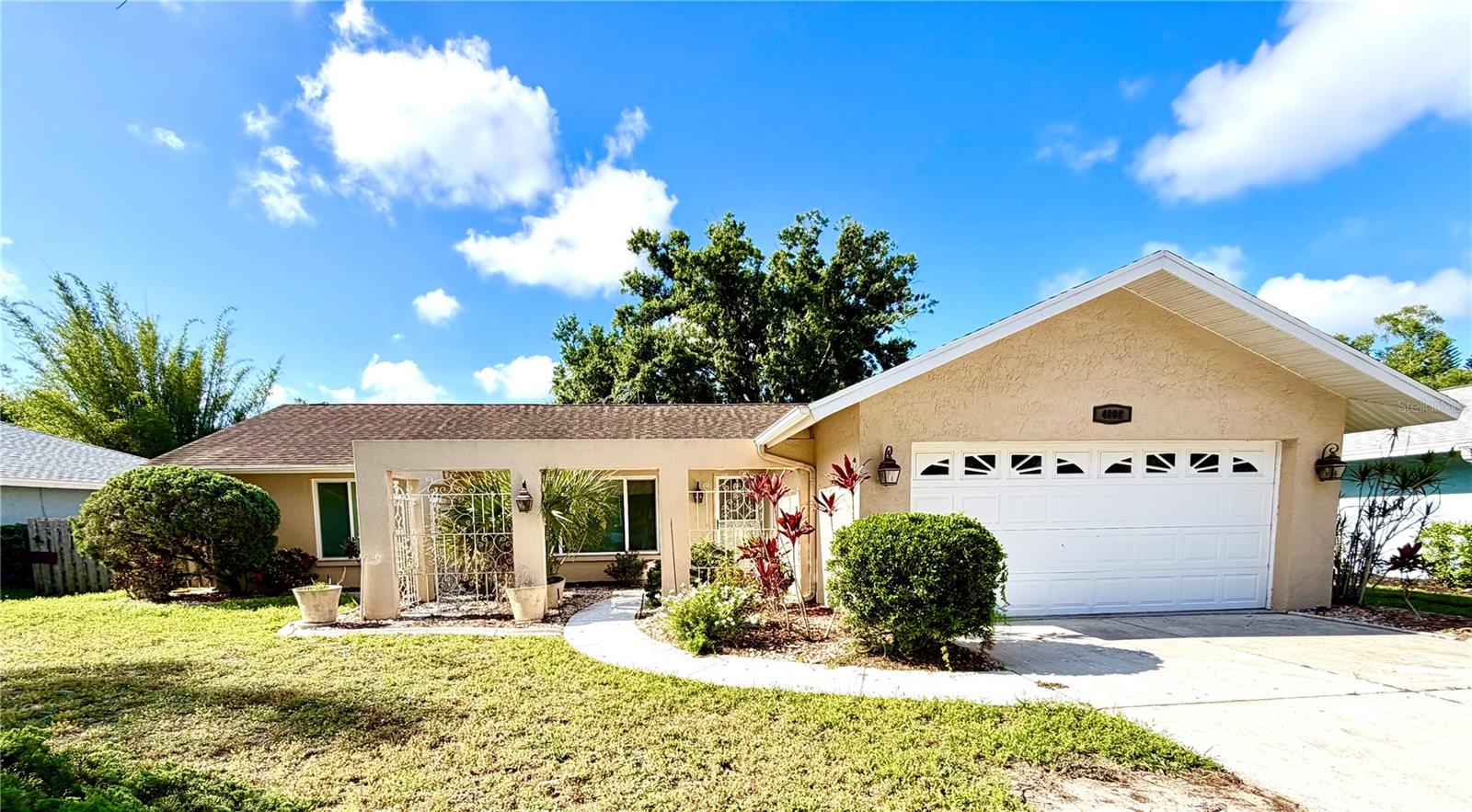 Located in the highly desirable The Meadows community near University Town Center, this spacious 3BR/2BA home offers a functional split floor plan, soaring beamed vaulted ceilings, and abundant natural light throughout. Features include hurricane-impact windows, remodeled bathrooms, an updated kitchen with granite countertops and breakfast bar, courtyard entry, and a large enclosed bonus room that expands the living space year-round. Spacious front and back yards provide plenty of room for tropical landscaping or a private vegetable garden.

Residents enjoy miles of scenic walking and biking trails, parks, lakes, a junior Olympic pool, fitness center, and a vibrant community social events calendar, along with access to additional optional amenities including golf, tennis, pickleball, and country club dining through available membership programs. Conveniently located near Nathan Benderson Park, The Mall at University Town Center, Sarasota-Bradenton International Airport, I-75, downtown Sarasota, dining, theaters, museums, colleges, shopping, and world-famous Gulf Coast beaches.