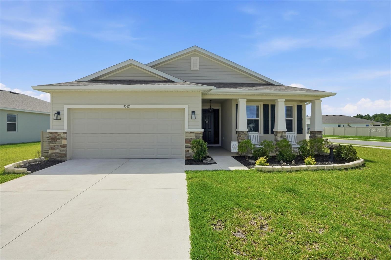 GORGEOUS ALMOST NEW HOME in Waterford WITH front porch...on one of the LARGEST lots and it's a Corner Lot! 3 bedrooms + 2 full bathrooms + 2 car garage + community pool + fenced backyard with vinyl white privacy fence + large covered and screen-in back lanai + 75' wide lot (look at the difference with all the other lots)! More space between neighbors on all sides!! All the upgrades!! High ceilings!! Large home with 1,844 sq feet living space; 2,560 total square feet!  Open floor plan with HIGH ceilings and large glass sliders and windows makes this home fell light, bright, and spacious!! Builder's balance of 10-year structural warranty is left and transferrable.

The kitchen offers the modern island breakfast bar with granite countertops, real wood cabinets, and stainless steel appliances! The master ensuite bathroom offers dual sinks, soaking tub and ceramic-tiled shower with glass door. Second bathroom has matching upgraded finishes and tub/shower combo.

This home is immaculate and well-maintained!! MOVE-IN READY!! Everything is upgraded!! Lots of extras to include the white vinyl privacy fencing, screened-in lanai, pavers added to the flower beds, Govee permanent lighting outside, laundry tub added in the laundry room, decorative cover panel for outside trash bin, gutters and downspouts added, backsplash added, spice rack in pantry, new upgraded ceiling fans throughout the home, tray ceiling and accent wall in the master bedroom, extra large glass slider in living room, and custom-built valences to match the cabinets!

But the best thing about this house, outside of its charming front porch to decorate for all the holidays...is the EXTRA LARGE CORNER LOT!!

Close to everything!! Shoppes, restaurants, hospitals, schools...everything!! Less than 5 minutes to kayaking, paddle-boarding, and swimming with the manatees in the clear Weeki Wachee River or enjoying a day at Buccaneer Bay Water Park!! 10 minutes to the sunsets at Pine Island, boating and fishing!! Less than 10 minutes to the Suncoast Parkway for quick and easy access to Tampa International Airport and for all the fun that Tampa Bay has to offer!! 1 hour + to TOP US BEACHES!! 1.5 hours to Disney World and Universal Studios and all the theme parks!!