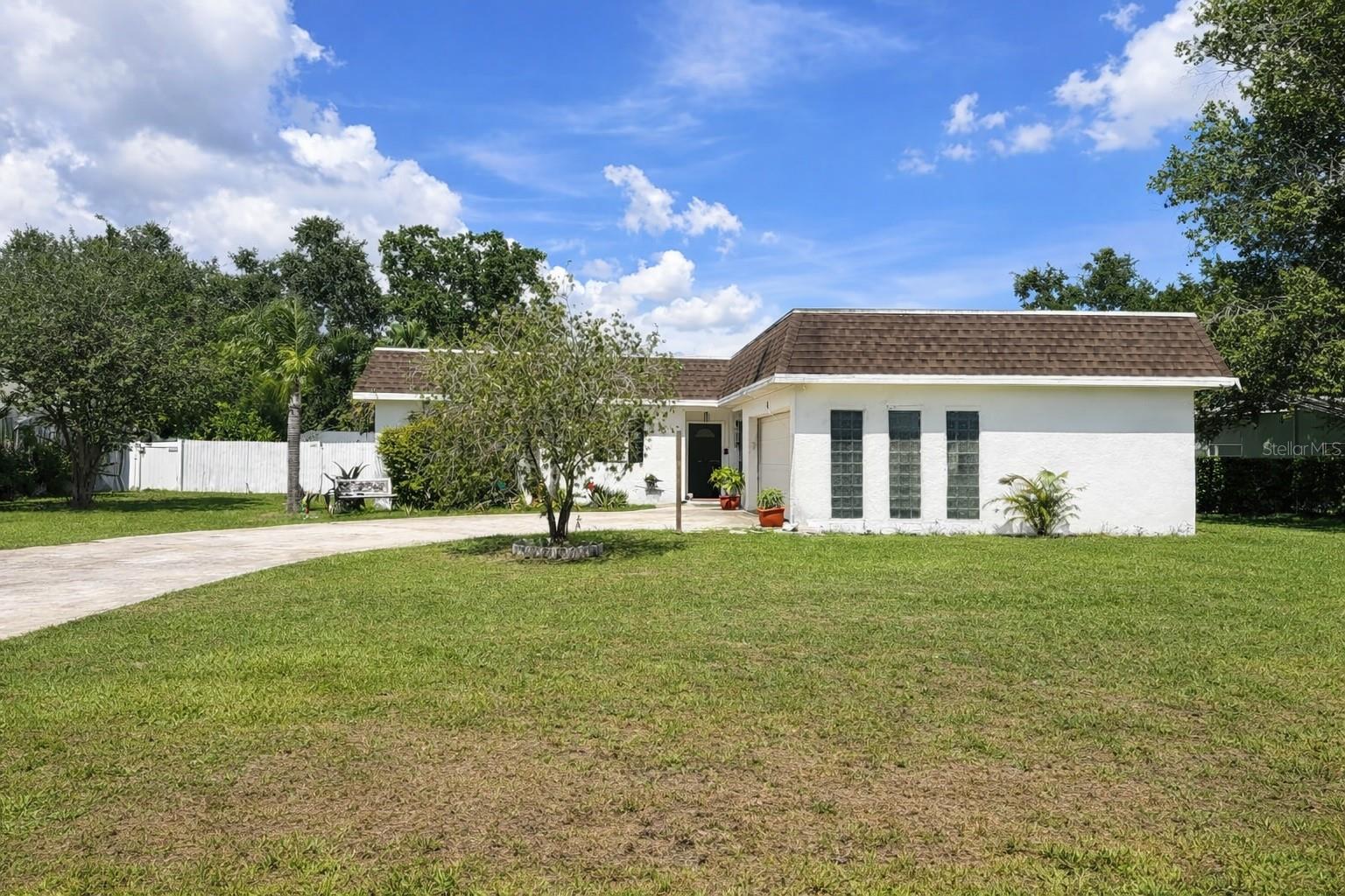 Welcome to this inviting 3-bedroom, 2-bathroom pool home with a 2-car garage, perfectly situated in the highly sought-after Lake Padgett Estates. This community is a water lover’s paradise, offering exclusive access to three ski-sized lakes and a dedicated fishing lake. Bring your boat and jet skis, and start living the Florida lifestyle you’ve always dreamed of!

Inside, the home features an expansive family and dining room combination, ideal for entertaining. The beautifully upgraded kitchen is a chef's delight, showcasing stunning granite countertops, ample cabinetry, a built-in wine rack, and a cozy adjacent eating space. Just off the kitchen, you’ll find a versatile bonus room—perfect for a home office—along with a dedicated laundry room that provides convenient access to the attached garage.

Step outside to your private oasis. Relax on the covered lanai or take a dip in the large, screen-enclosed pool, all surrounded by a serene and exceptionally private backyard.