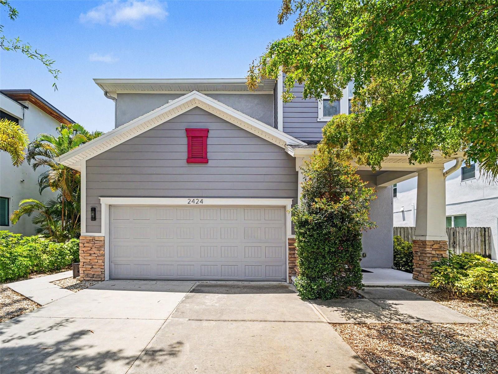 Virtually Staged. Welcome to this beautifully designed 4-bedroom, 3.5-bathroom two-story home located in the desirable Hudson Park community in Sarasota — with no HOA fees or restrictions. Built in 2015, this thoughtfully crafted home features modern finishes and an open-concept layout, offering the perfect blend of comfort, style, and functionality. To provide additional peace of mind, thoughtful upgrades include a new HVAC system (replaced in 2026), water softener, and newer water heater (2021).

Step inside to discover ceramic tile flooring throughout the entire lower-level living spaces, designed to mimic the warmth and elegance of natural wood. High ceilings and expansive windows fill the living room and dining room combination with abundant natural light, creating a bright and airy atmosphere. Sliding glass doors seamlessly connect the indoor living space to the screened-in patio - which has been pre-wired for a hot tub installation- providing a perfect location for relaxing or entertaining guests.

The spacious primary suite is conveniently located on the first floor and features a luxurious ensuite bathroom complete with a modern walk-in shower, dual-sink vanity, and a custom walk-in closet with built-in organization and exceptional storage space. A conveniently located half bathroom on the lower level provides added comfort for guests.

At the heart of the home is the stunning modern kitchen, showcasing warm gray wood cabinetry, beautiful granite countertops, stainless steel appliances including a built-in oven, microwave, refrigerator, dishwasher, range hood, and an electric cooktop. The oversized kitchen island offers generous seating options, while the mosaic tile backsplash and recessed lighting add stylish finishing touches.  Enjoy filtered water (filtered by reverse osmosis) directly from the kitchen sink. Just off the kitchen, the laundry room includes washer and dryer hookups for everyday convenience.

Upstairs, a large loft provides flexible living space ideal for a media room, office, or play area. The second level also includes three generously sized bedrooms, all featuring plush carpeting, along with two full bathrooms designed to accommodate family and guests with ease.

Enjoy Florida living year-round from the screened rear porch overlooking the fenced backyard — offering privacy and plenty of room for outdoor enjoyment.

Conveniently located near restaurants, Sarasota Memorial, Legacy Trail, Pompano Trailhead, Pickleball Courts and shopping, this home also places you just minutes from Marie Selby Botanical Gardens, Bayfront Park, and several area golf courses. Spend your weekends enjoying the beautiful Gulf Coast beaches with South Lido Key Beach Park and other stunning Gulf of Mexico beaches just a short drive away. 

This exceptional home combines modern design, spacious living, an unbeatable location, and the added benefit of no HOA, making it the perfect place to call home.