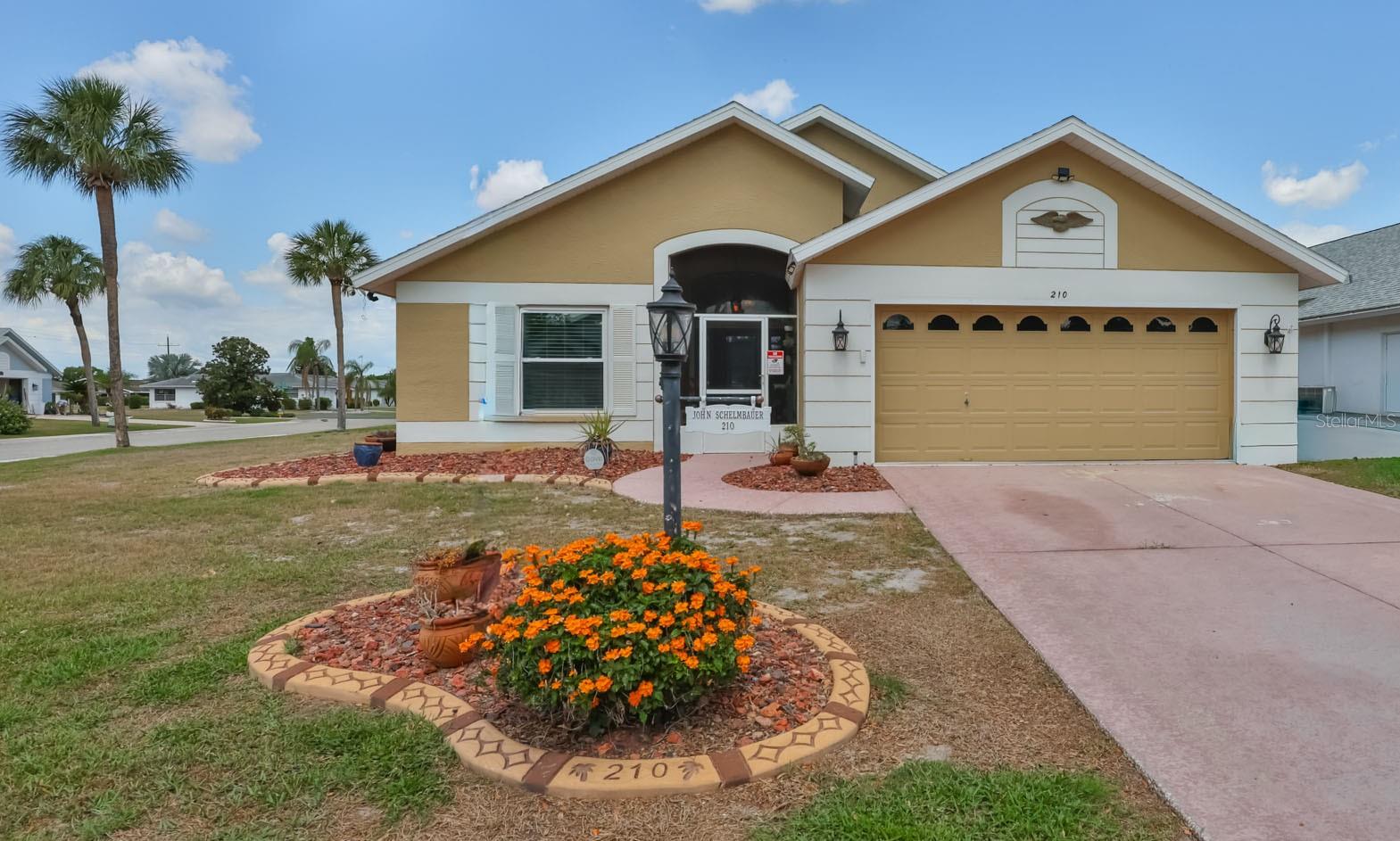 WELCOME TO YOUR CORNER OF PARADISE! This Dorel split floor plan is located on the north side of Sun City Center. This lovely corner lot home is move-in ready and has been updated throughout. From the newer painted exterior, upgraded concrete curbing, and magnificent rear paver patio to name just a few improvements, this home is full of appeal. Step into the inviting screened lanai and through the elegant hurricane entry door, and you will appreciate every detail of this wonderfully updated home. From the moment you enter, you will be pleased with the beautiful acacia engineered hardwood flooring throughout, cathedral ceilings, exquisitely remodeled kitchen, and additional living space from the enclosed lanai. The separate dining and living rooms, nestled around the modified galley-style kitchen, provide plenty of space for entertaining family and friends. The primary bedroom has dual walk-in closets and French door that opens into the spacious enclosed rear lanai. The primary En suite features dual high-top sinks, a superb oversized tiled walk-in shower, and a separate makeup area. The sizable second bedroom is on the opposite side of the home, offering plenty of privacy for guests and additional closet space to help keep you and your home organized. Enter the den through the double French doors, which creates a great space for an office, den, or craft room—whatever suits your lifestyle. The home also includes an indoor laundry room with cabinets and counter space for sorting and folding laundry. Your two-car garage has a side garage door that opens into the sizable corner yard. The elaborate rear patio with firepit and built-in seating is the perfect place to enjoy sun-filled days and unwind after a busy day. Recent upgrades include a 2025 HVAC system, 2022 hurricane-rated 14 windows and entry door replacement, 2021 PEX replumbing, and a 2015 roof replacement just to name a few. Sun City Center (SCC) is an active 55+ golf cart community that is close to big city entertainment, shopping & airports. SCC offers indoor and outdoor pools and spas, a Sate-of-the art well-equipped fitness center, a community hall, library, clubhouses, arts and crafts, outdoor sports, and golf. Schedule your tour today & ask for this gem's home feature sheet. Don't wait, make this home your own, start discovering the joy of living in Sun City Center.