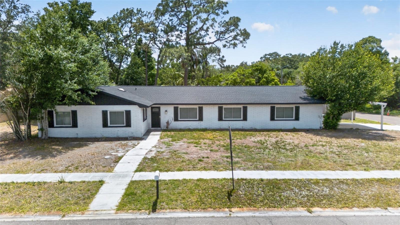 Auction Property. LIST PRICE IS FOR MLS PURPOSES ONLY. ACTUAL PRICE WILL BE DETERMINED AT AUCTION. ONLINE AUCTION ENDS JUNE 16 AT 11:30 AM ET. This 4BR/2BA home is situated on a spacious .34± AC corner lot. Will sell regardless of price, subject to Bankruptcy Court approval. Modern kitchen offers island w/breakfast bar, stainless appliances, granite counters, and soft-close shaker style cabinets. Bathrooms updated with granite top vanities and stylish tile. Side-entry 2-car garage with carport. Wooden privacy fence with double gate. Back taxes (’23-’25) to be paid by buyer at closing. Property #: DG26022-2. Bid Online June 9 - 16. 10% Buyer's Premium. Sale is subject to approval by the United States Bankruptcy Court for the Middle District of Florida in Case No. 8:26-bk-01636-CPM.