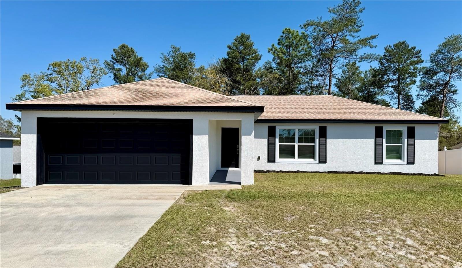Offering a combination of modern updates and functional living space, this 3-bedroom, 2-bath concrete block home is ready for its next owner. Fresh interior and exterior paint, luxury vinyl plank flooring, updated lighting, and granite countertops throughout create a clean and inviting feel. The kitchen features stainless steel appliances, ample cabinet space, and an open layout that flows into the main living area and out to the new deck overlooking the fully fenced backyard. Both bathrooms have been tastefully updated with granite countertops and modern fixtures. The spacious primary suite includes a walk-in closet, dual vanities, a large walk-in shower, and a linen closet, while the additional bedrooms has generous space and storage. The roof, AC, and water heater were all replaced in 2021 for added peace of mind. Located on a quiet, low-traffic street near shopping, dining, and everyday conveniences, this move-in-ready home is one you won't want to miss. —Schedule your showing today!!