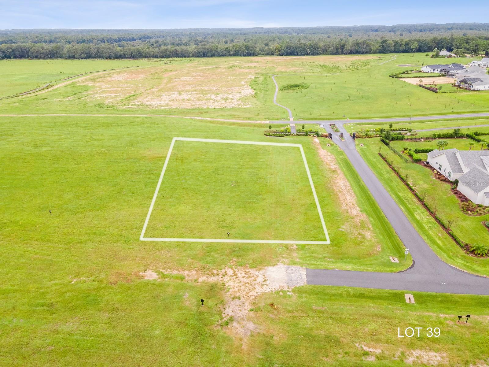 Lot 39, a premium East facing corner 1-acre homesite in the exclusive gated Garden subdivision of Flint Rock. The perfect canvas to create your dream home with AR Homes, known for their fully customizable luxury home designs that bring your vision to life. 2,600 minimum living sqft allows for the perfect home size for any size family. As part of Gainesville’s first Agrihood, Flint Rock promotes a lifestyle focused on wellness, community, and a deep connection to the land. Residents enjoy more than just a home; they become part of a vibrant, sustainable community. Stroll along 2.5 miles of walking paths through lush landscapes and preserved green spaces. Experience the joy of fresh, locally grown produce from the community gardens and orchards. Flint Rock’s thoughtfully designed amenities, including an Event Barn for hosting memorable gatherings and a Residents’ Farmhouse complete with a full catering kitchen, create endless opportunities to connect with neighbors and celebrate life’s special moments. Relax by the paver fire pits, unwind on trellised swings, or take in the beauty of butterfly-filled herb gardens. Underground utilities, Clay Electric, AT&T fiber internet, private eco-friendly well/septic and more.