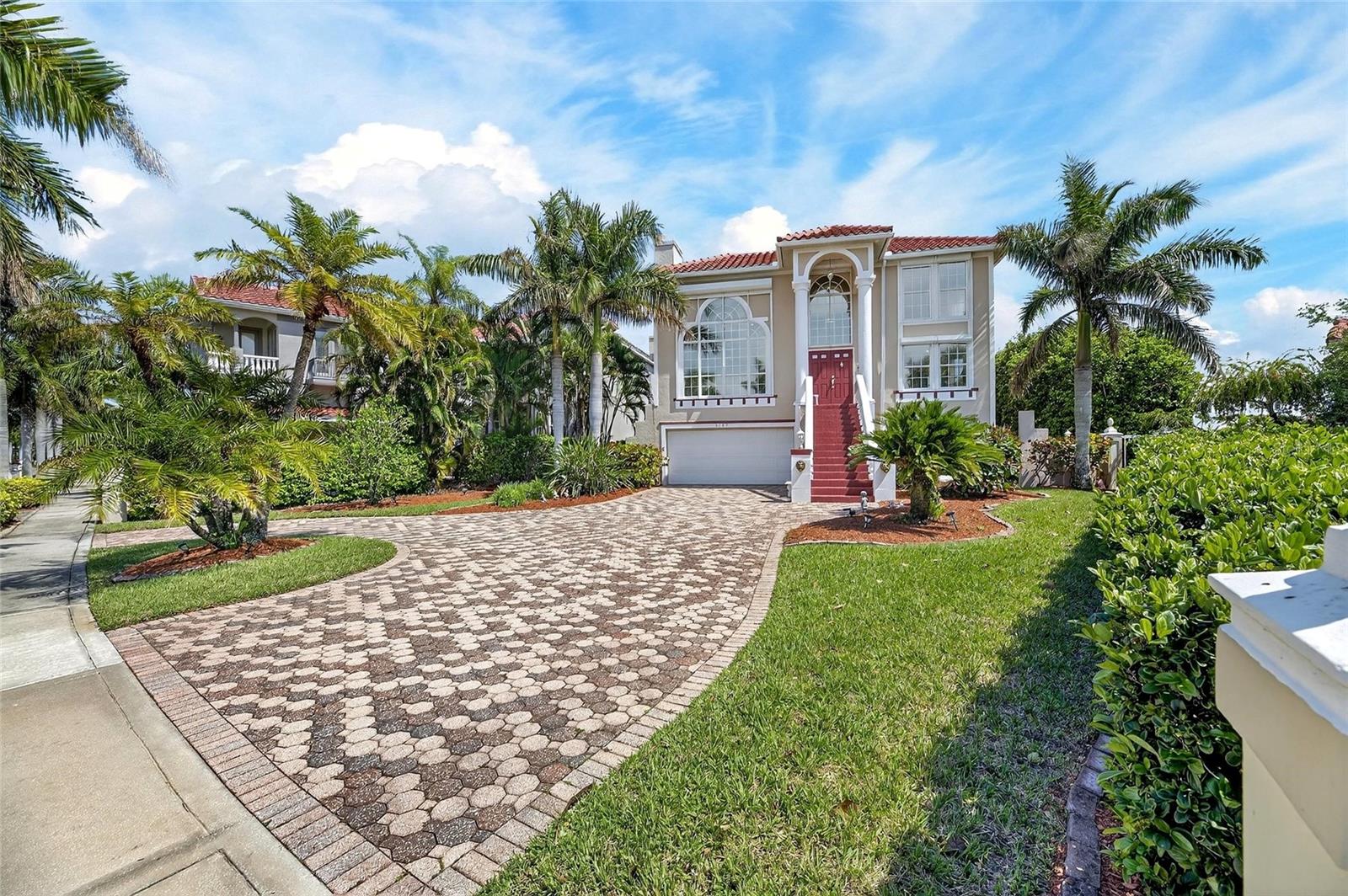 6107 Marbella Blvd, Apollo Beach, FL | 4 Bedrooms | 5 Bathrooms | 5,206 Sq Ft | Canal Front | Private Dock & Lift | Gated Andalucia

Located in the guard-gated waterfront community of Andalucia, this custom-built 4-bedroom, 5-bath canal-front residence offers over 5,200 square feet of living space with direct access to Tampa Bay. Positioned on a deep-water canal, the property includes a private dock with boat lift, making it ideal for boating and waterfront living. The home is situated directly across the street from the community clubhouse, pool, and tennis courts, offering convenient access to amenities just steps from your front door.

Designed with a unique Feng Shui-inspired layout, the home includes a den, loft, studio, and expansive recreation room, providing flexibility for both everyday living and entertaining. The interior features soaring ceilings, marble flooring, and abundant natural light throughout, with water views from nearly every room. The family room and den are enhanced with custom-built mahogany shelving, creating warm, functional spaces for both relaxation and work. The loft includes a custom built-in bar, adding another space for entertaining. Multiple levels and living areas create separation and flow, while balconies capture canal views and partial views of Tampa Bay.

The kitchen is equipped with granite countertops, stainless steel appliances, and a center island, opening to the main living areas and outdoor spaces.

This home offers two primary suites, each designed as a private retreat with sitting areas overlooking the canal, large walk-in closets, whirlpool soaking tubs, and walk-in showers. A third bedroom also features its own en suite bathroom, providing additional privacy and comfort for guests or family.

Outdoor living is central to the home, with multiple balconies and gathering areas designed to take advantage of the waterfront setting. The private dock provides quick access to Tampa Bay and features bench seating and underwater green lighting for a unique nighttime ambiance, creating an ideal setting to relax, entertain, or watch marine life. A six-person jacuzzi overlooking the canal, ping pong table, and pool table are included, offering additional entertainment and value.

Additional features include a tile roof (2023), updated HVAC systems, circular paver driveway, and a 2-car garage.

Andalucia is a 24-hour guard-gated waterfront community known for its custom homes, privacy, and boating access. Residents enjoy a private marina with deep-water access to Tampa Bay and the Gulf, clubhouse and pool, tennis courts, playground, and a scenic waterfront pier with sunset views. The neighborhood is golf-cart-friendly and conveniently located near waterfront dining, beaches, and commuter routes to Tampa.

This is an opportunity to own a waterfront home in one of Apollo Beach’s most established gated communities, offering space, flexibility, direct boating access, and immediate proximity to community amenities.
