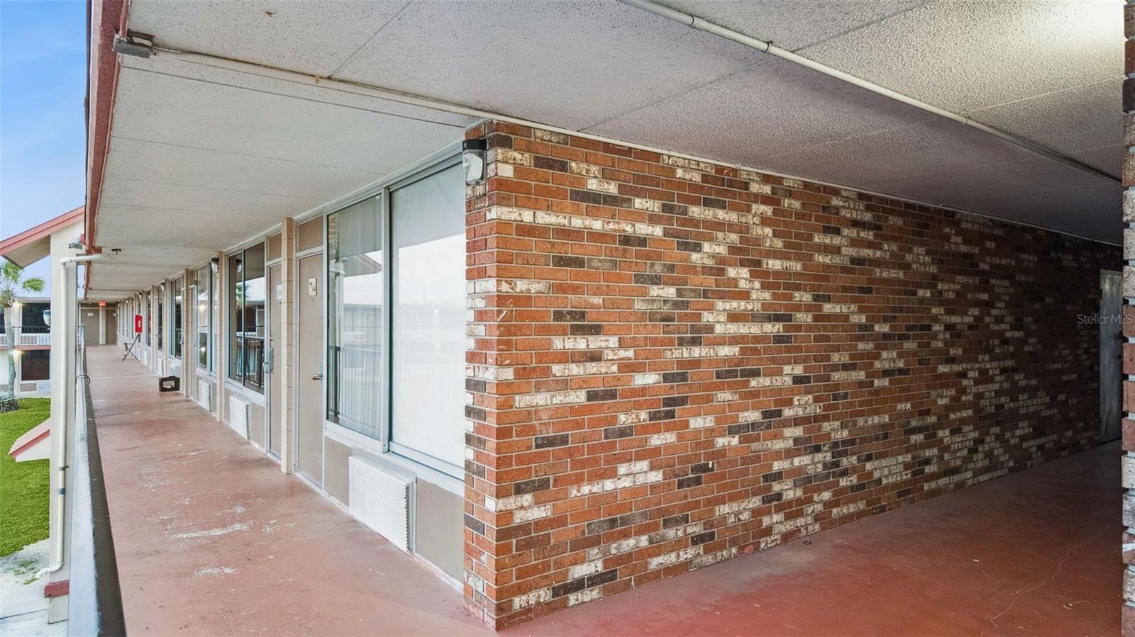 ***PRICE IMPROVEMENT!***Excellent INVESTMENT OPPORTUNITY Near Disney! This FULLY FURNISHED, UPDATED Studio Condo with POOL VIEW, features a Queen Size Bed, Sofa that converts into a Double Bed, Coffee Table, Kitchen Table and Chairs, Desk with Chair, Cubby with extra storage and a TV, too! An HOA fee of just $242/month covering ALL major utilities including Electric, Water & Trash, makes this property an Affordable, Permanent Residence or a Hassle-Free Investment! The 2nd Floor END UNIT, with immediate staircase access, boasts modern ceramic tile flooring throughout, a FULLY UPGRADED BATHROOM with a Gorgeous Shower & Kitchenette Area including a Microwave, Refrigerator and Keurig Coffee Maker for Added Convenience. In addition, the property has a Community Pool RIGHT OUT SIDE YOUR DOOR, Laundry Facilities in the same building, Gazebo Area and lush green spaces for relaxation, offering a fantastic balance of Comfort, Convenience, and Investment Potential. LOCATION, LOCATION, LOCATION! With Posner Commons Shopping Center within walking distance, directly across the street from the property, featuring several job opportunities, restaurants, shopping and an IMAX Movie Theatre, PLUS the Convenience of major I-4 Highway just a few minutes from the Resort, offering easy access to all Theme Parks, Tampa and Orlando, this condo is supreme! Featured popular stores include Starbucks, Chipotle, Dunkin' Donuts, Panda Express, Ale House, Popeye's, Crumbles, Ross, ULTA, Bealls, Five Below, Best Buy, Dick's Sporting Goods, HomeGoods, Staples, BJ's, JCPenny, and Target, just to name a few and Walmart, Lowe's and a Hospital are just a few minutes down the road. Whether you're looking for an Affordable Place to call your own or a property that Generates Steady Rental Income ($975-$1,100/month), this Condo is an IDEAL choice for ALL!