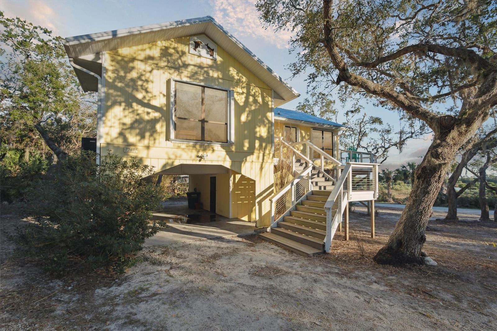 Welcome to the Sun Kissed Tree House in Cedar Key! Discover the charm of Cedar Key with the "Sun Kissed Tree House," a delightful 2-bedroom, 2-bathroom home boasting vaulted ceilings and a unique elevated design. Situated safely above the base flood elevation, this home stood resilient through recent historic storms, offering peace of mind. Currently a successful vacation rental, it presents a versatile opportunity for continued income or personal use as a tranquil residence or vacation getaway. About Cedar Key: Nestled along Florida's Nature Coast, Cedar Key blends quaint coastal living with rich history. Originally a thriving port for shipping goods, it now beckons with its artistic community, local seafood delicacies, and breathtaking sunsets over the Gulf. Embrace island living with outdoor activities like fishing, kayaking, or simply strolling through historic streets lined with colorful cottages and shops. Don't miss your chance to own a piece of Cedar Key's charm at the "Sun Kissed Tree House." Whether you're seeking a new home or an investment property, this is your opportunity to live amidst natural beauty and historic allure.