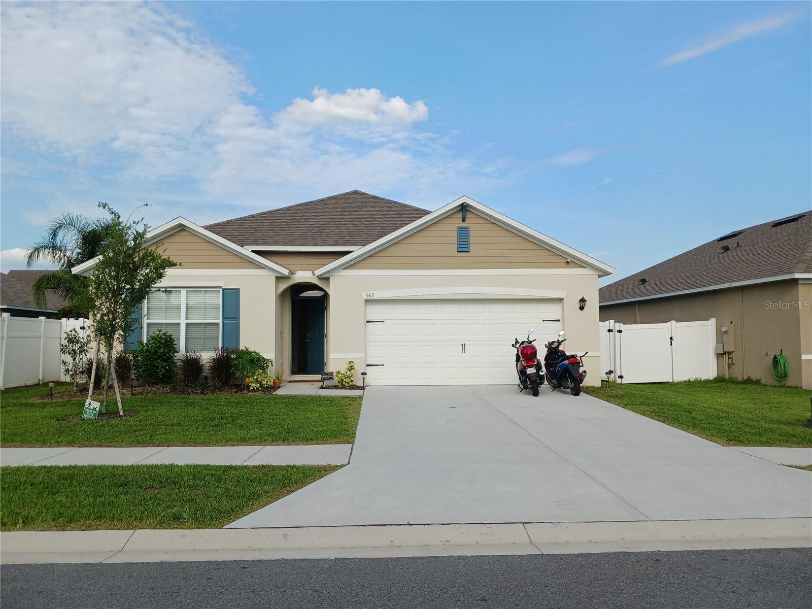 Welcome to 563 Honey Bell Rd, a home that beautifully blends modern comfort, style, and the relaxed Florida lifestyle. From the moment you arrive, you’ll feel the inviting atmosphere of this well-kept community and the pride of ownership reflected throughout this 4-bedroom, 2-bath residence. Step inside and experience a bright, open floor plan filled with natural light—an uplifting space that instantly feels like home.

The heart of the property is its elegant, contemporary kitchen, featuring stainless steel appliances, a spacious island, and generous counter space that makes cooking, gathering, and entertaining effortless. The seamless flow into the living and dining areas creates a warm, connected environment perfect for everyday living and special moments with family and friends. Large windows overlook the backyard, allowing sunlight to pour in and giving the home a fresh, airy feel throughout the day.

The primary suite offers a peaceful retreat with a spacious layout and a private bath designed for relaxation. Three additional bedrooms provide versatility for guests, a home office, or a growing household. Every corner of this home feels thoughtfully designed to support comfort, convenience, and a lifestyle that feels elevated.

Step outside to a spacious backyard that invites you to unwind, enjoy the Florida breeze, or create the outdoor oasis you’ve always imagined. Whether it’s morning coffee on the porch, weekend barbecues, or quiet evenings under the sky, this outdoor space offers the perfect backdrop for relaxation and connection. Lake view.

Located in one of Winter Haven’s most desirable and fast-growing areas, this home offers exceptional convenience for professionals commuting to Orlando, Lakeland, or Davenport. You’re just minutes from shopping, dining, hospitals, scenic lakes, parks, and the excitement of Legoland Florida. Here, you enjoy the rare combination of accessibility, tranquility, and a welcoming neighborhood atmosphere.

An added advantage: this property already features a reliable tenant in place, making it an excellent opportunity for investors seeking immediate income in a high-demand rental market. Whether you’re looking for a primary residence or a strong investment asset, 563 Honey Bell Rd delivers value, comfort, and long-term potential.

This home is more than a place to live—it’s a space to build memories, find comfort, and enjoy the best of Central Florida living. Move-in ready, beautifully maintained, and perfectly located, it offers an exceptional opportunity for anyone seeking quality, convenience, and a lifestyle that feels truly elevated.